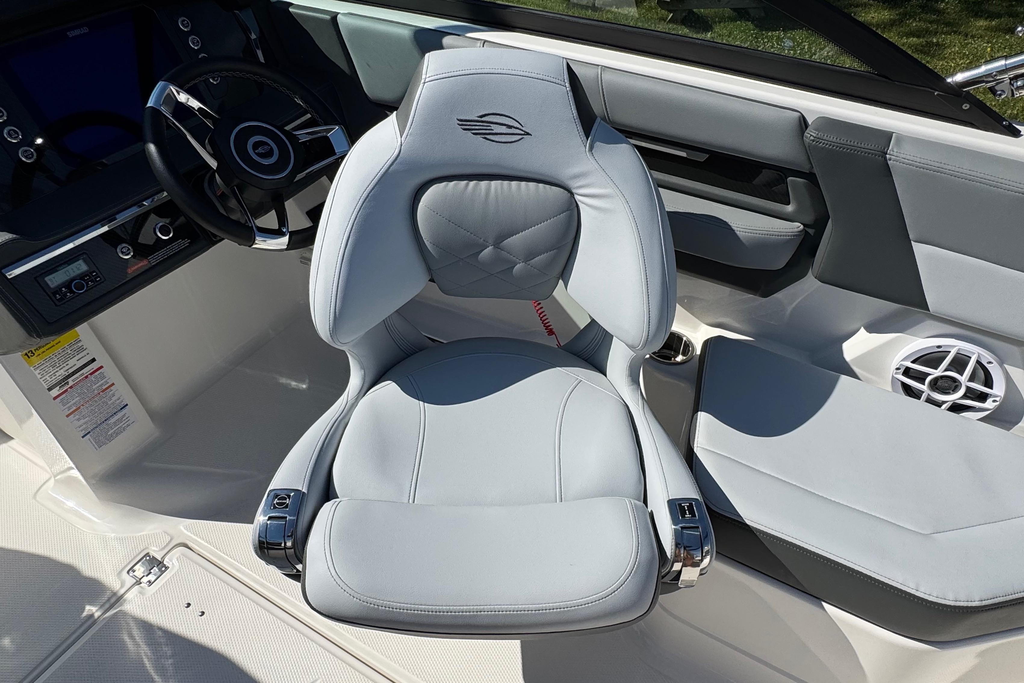 2026 Chaparral SSX 4 boat interior with luxurious seating and modern steering wheel design.