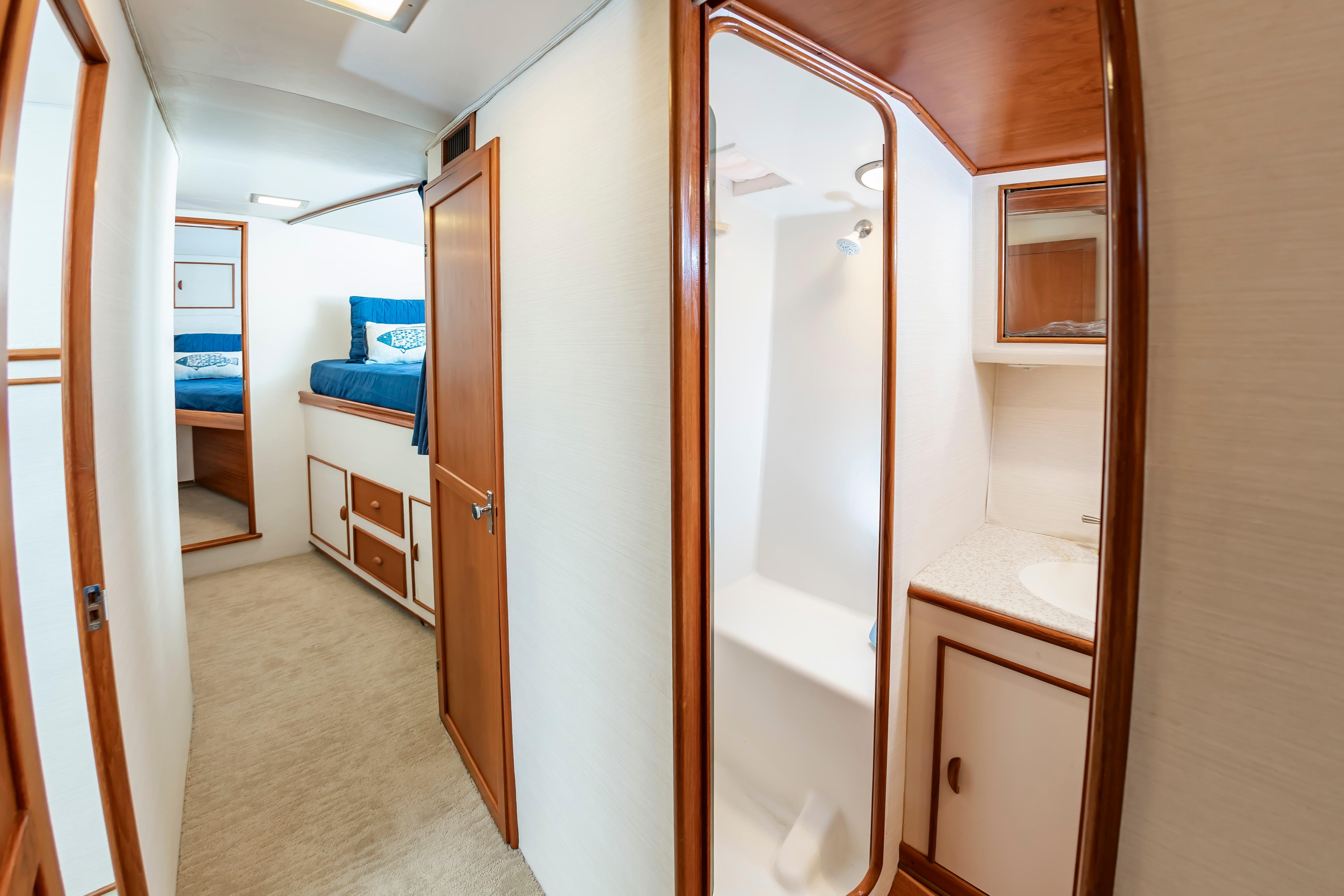 Interior of 1993 Custom Carolina Scarborough 56 Convertible yacht, featuring cabin and bathroom.