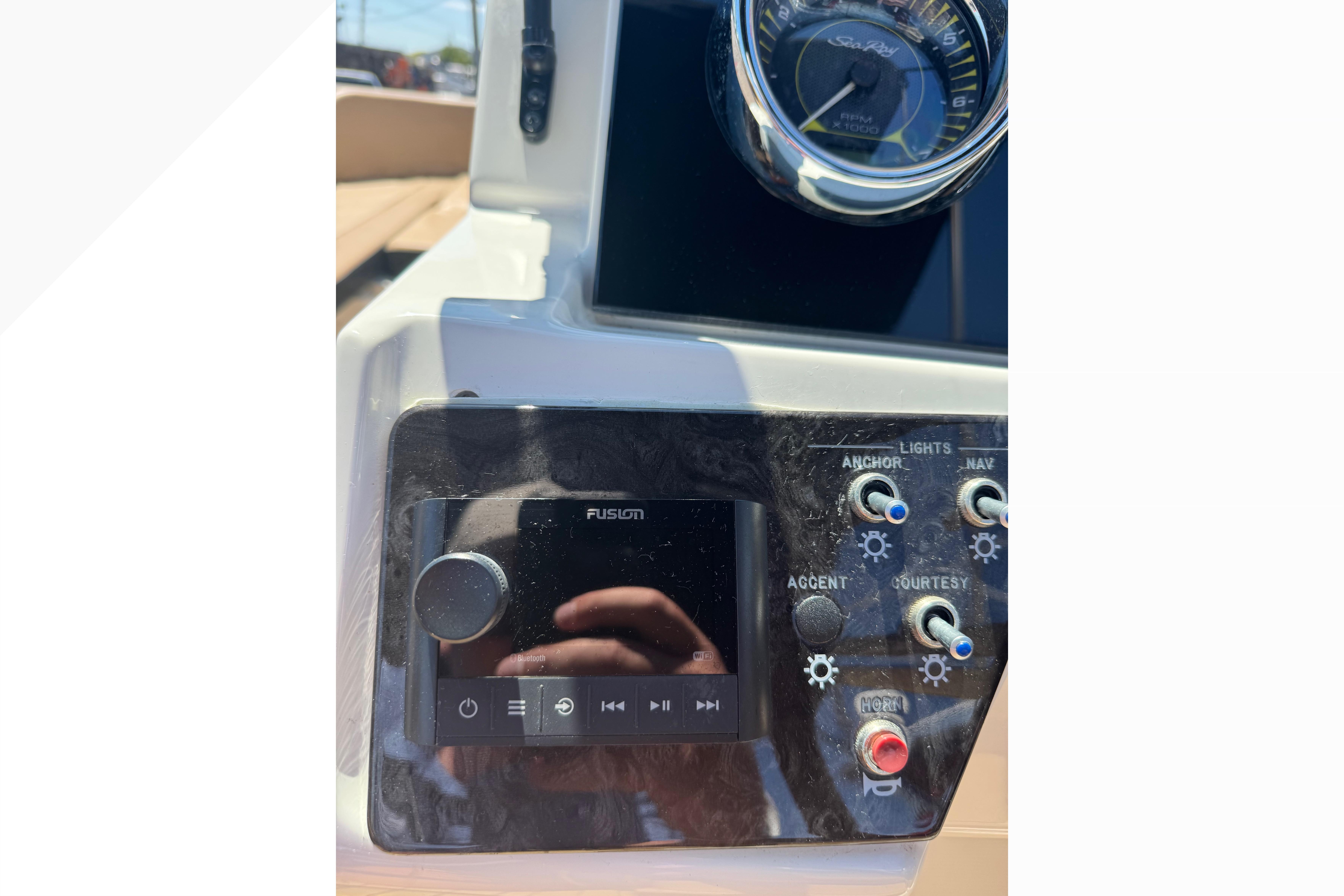 Control panel of a 2021 Sea Ray SPX 190 boat with Fusion audio system.