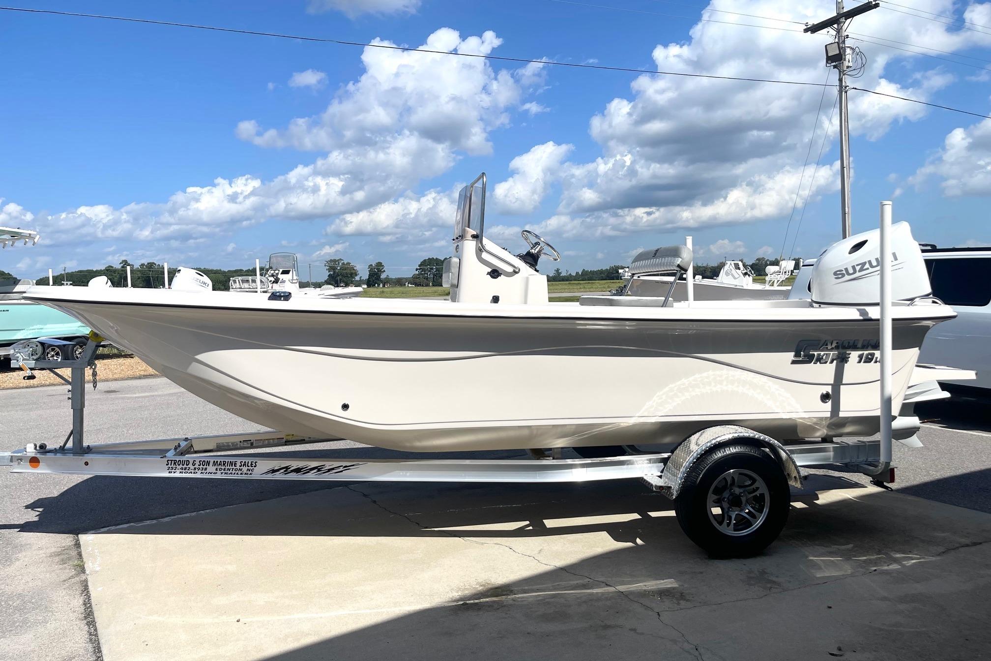 2026 Carolina Skiff 19 LS boat on trailer under a clear blue sky.