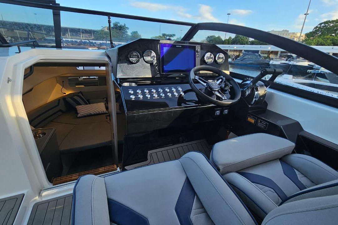 Luxurious 2027 Hanover 327 boat interior with modern cockpit and cozy cabin area.