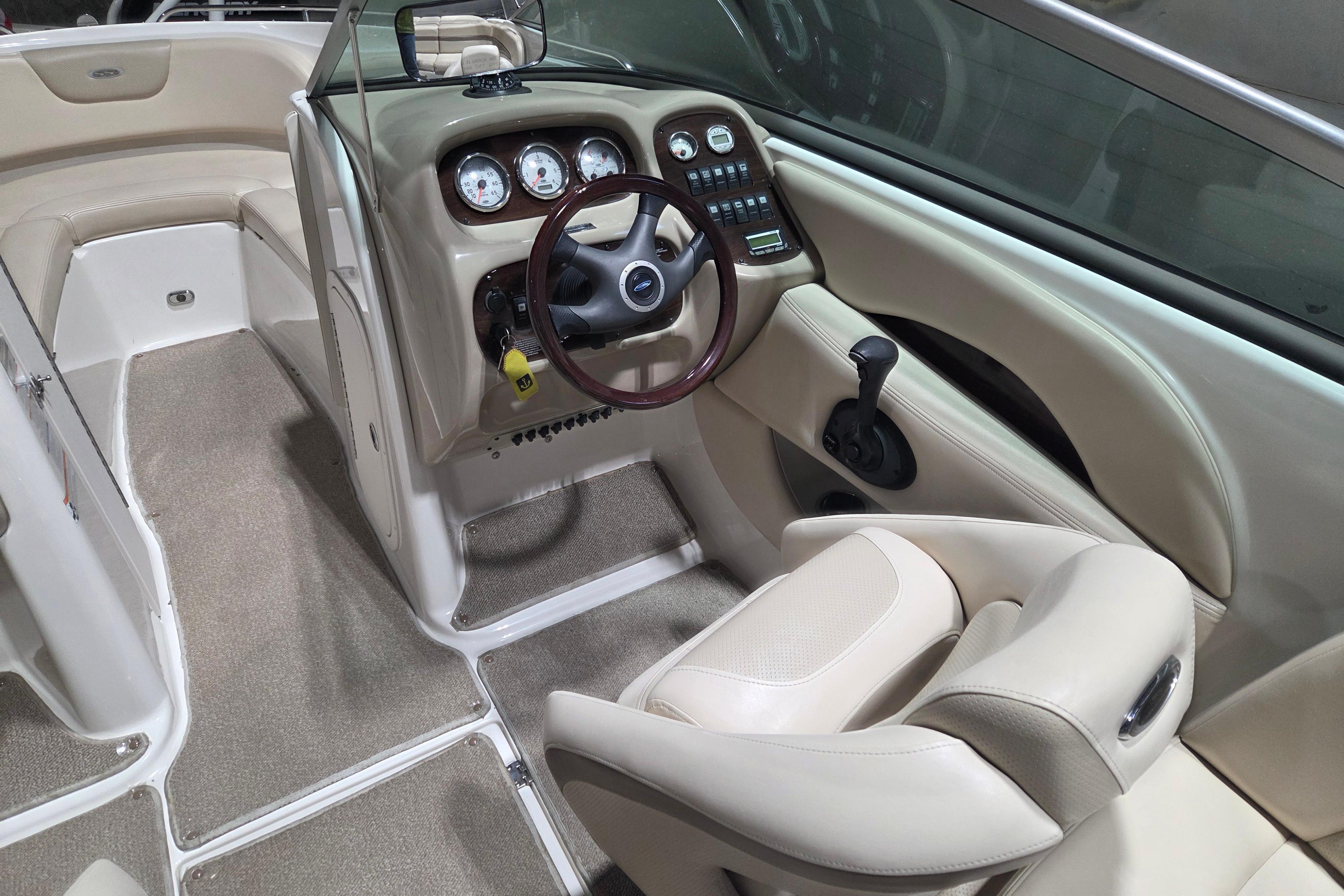 2006 Chaparral 236 SSi boat interior with steering wheel and dashboard controls.