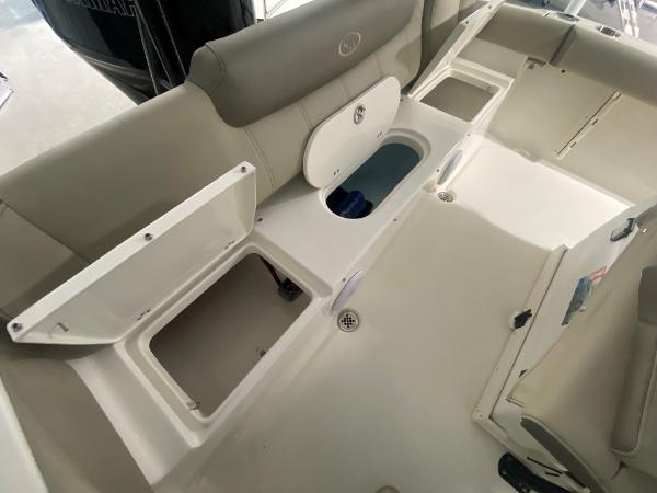 2024 Key West 219 FS boat interior with open storage compartments.