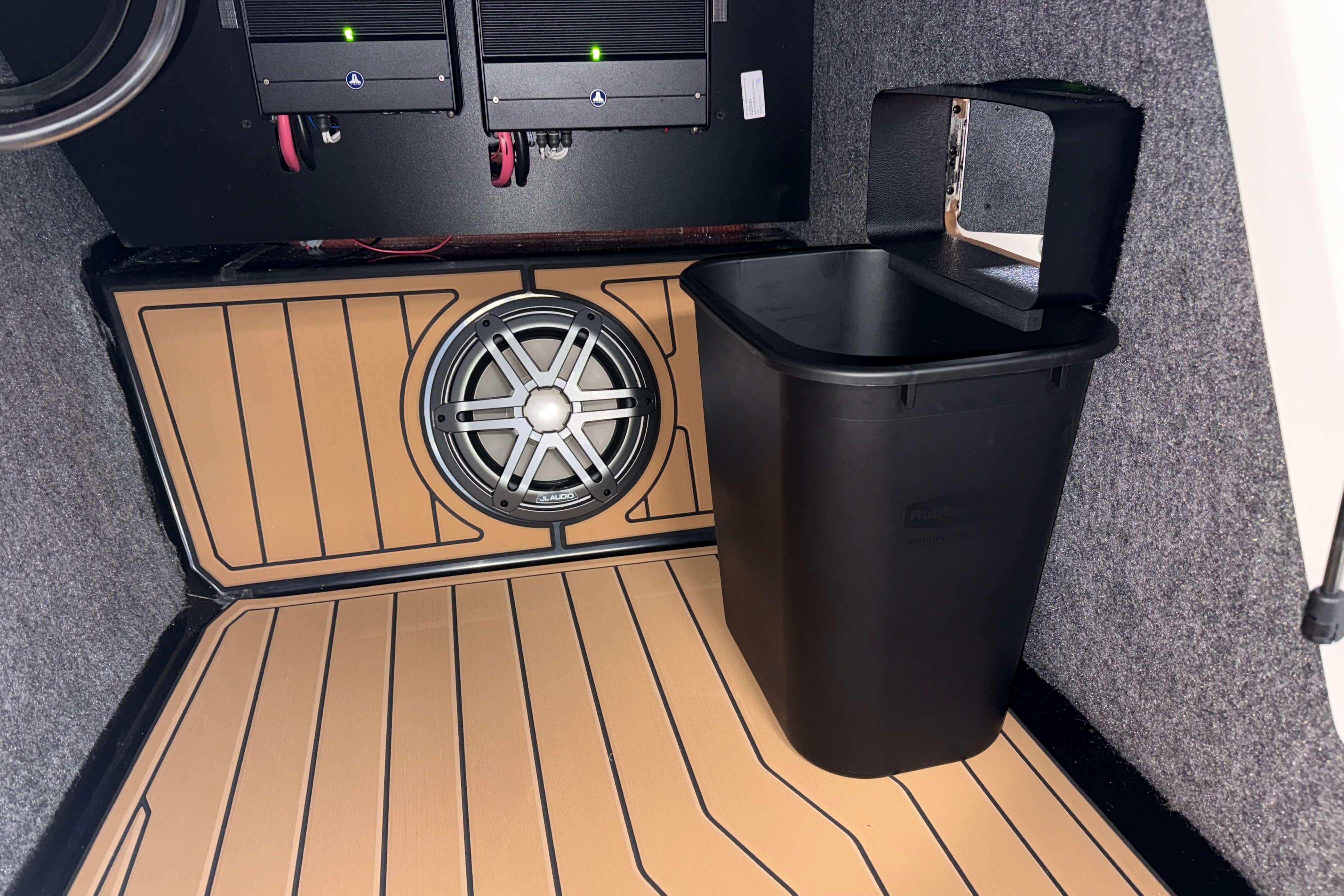 Interior of 2026 Nautique Super Air Nautique S23 with speaker and storage bin.