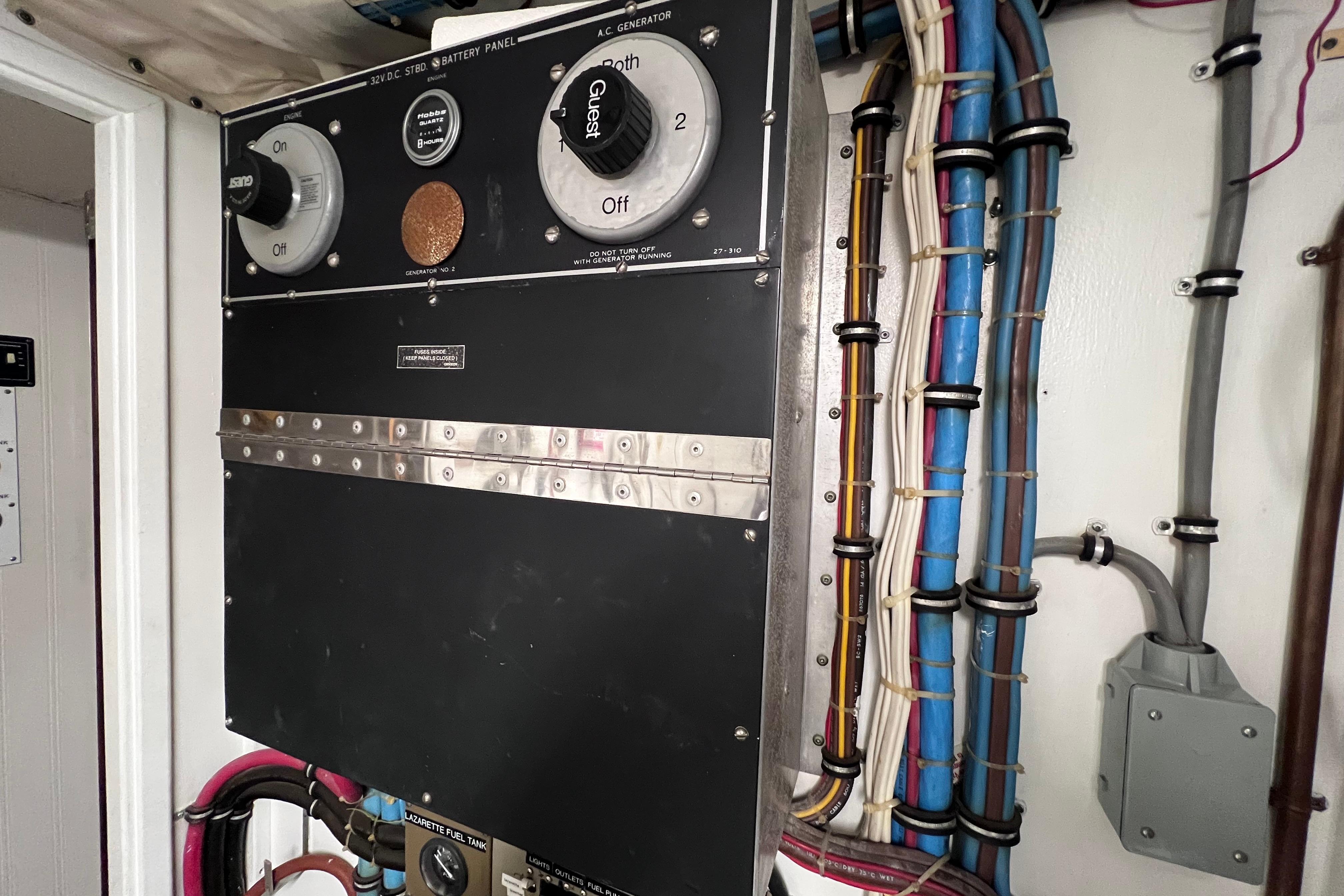 Electrical panel with wiring on a 1987 Hatteras 70 Cockpit Motor Yacht.