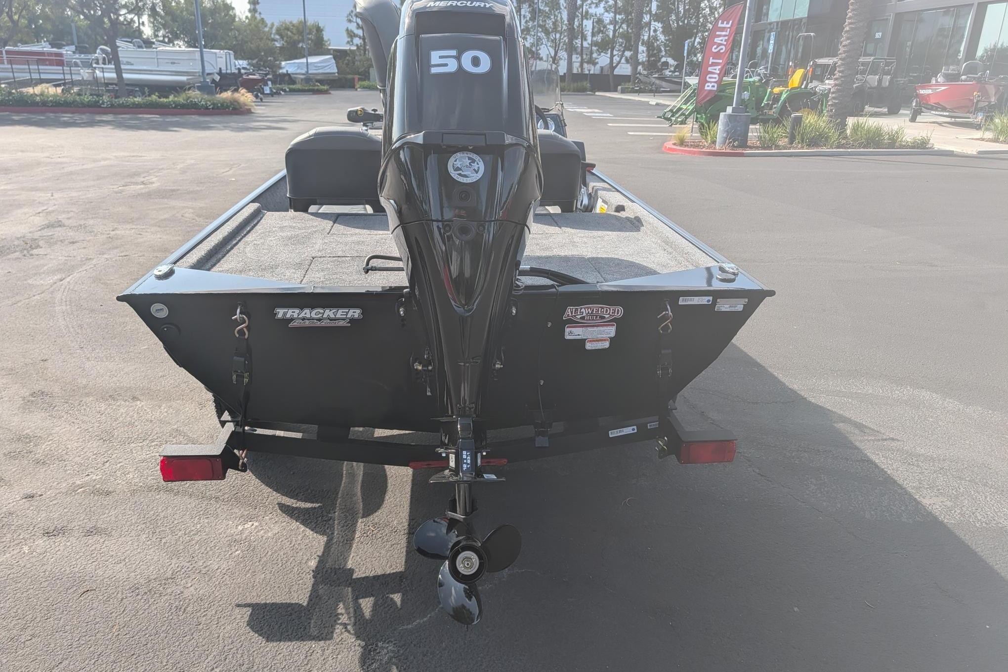 2026 Tracker Bass Tracker Classic XL boat with Mercury 50 engine, parked outdoors.