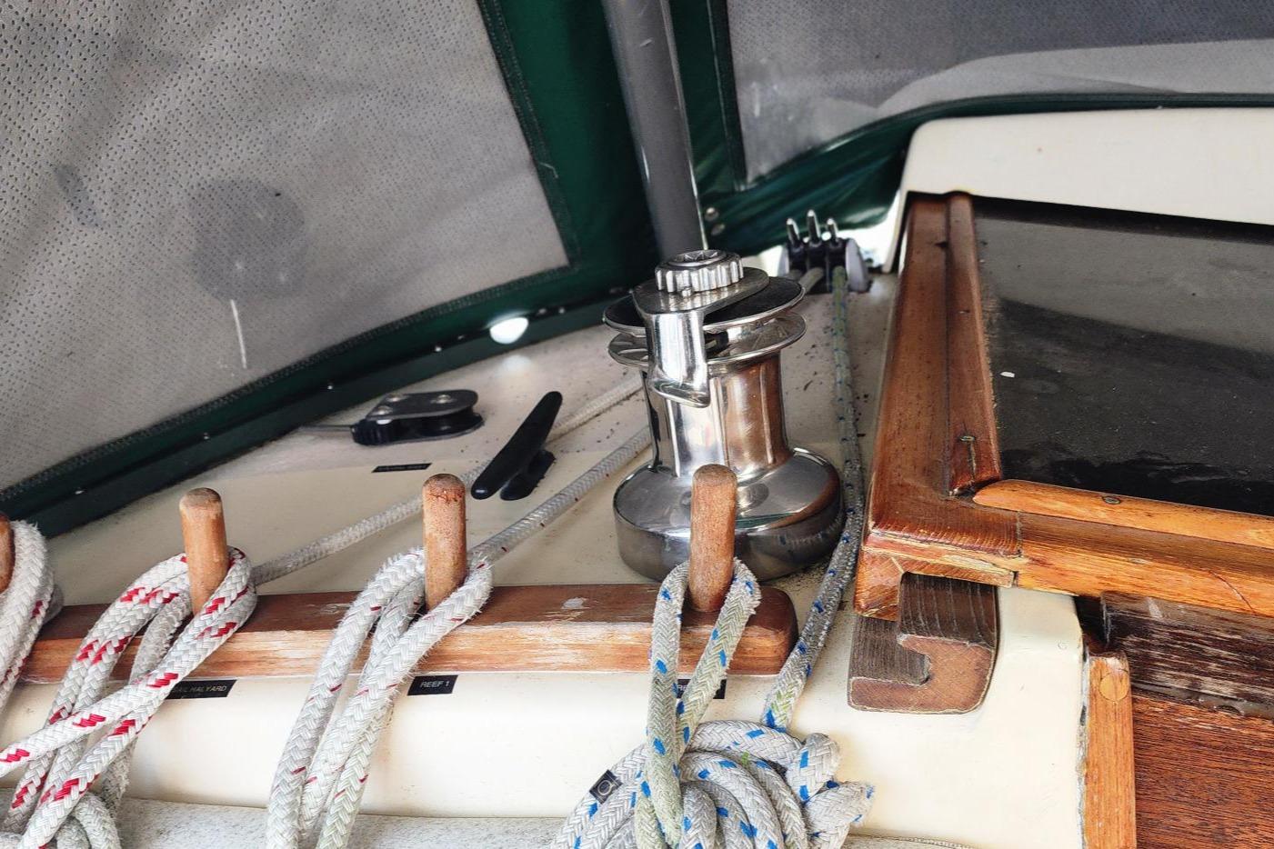 1984 Clearwater Cutter sailboat deck with ropes and winch.