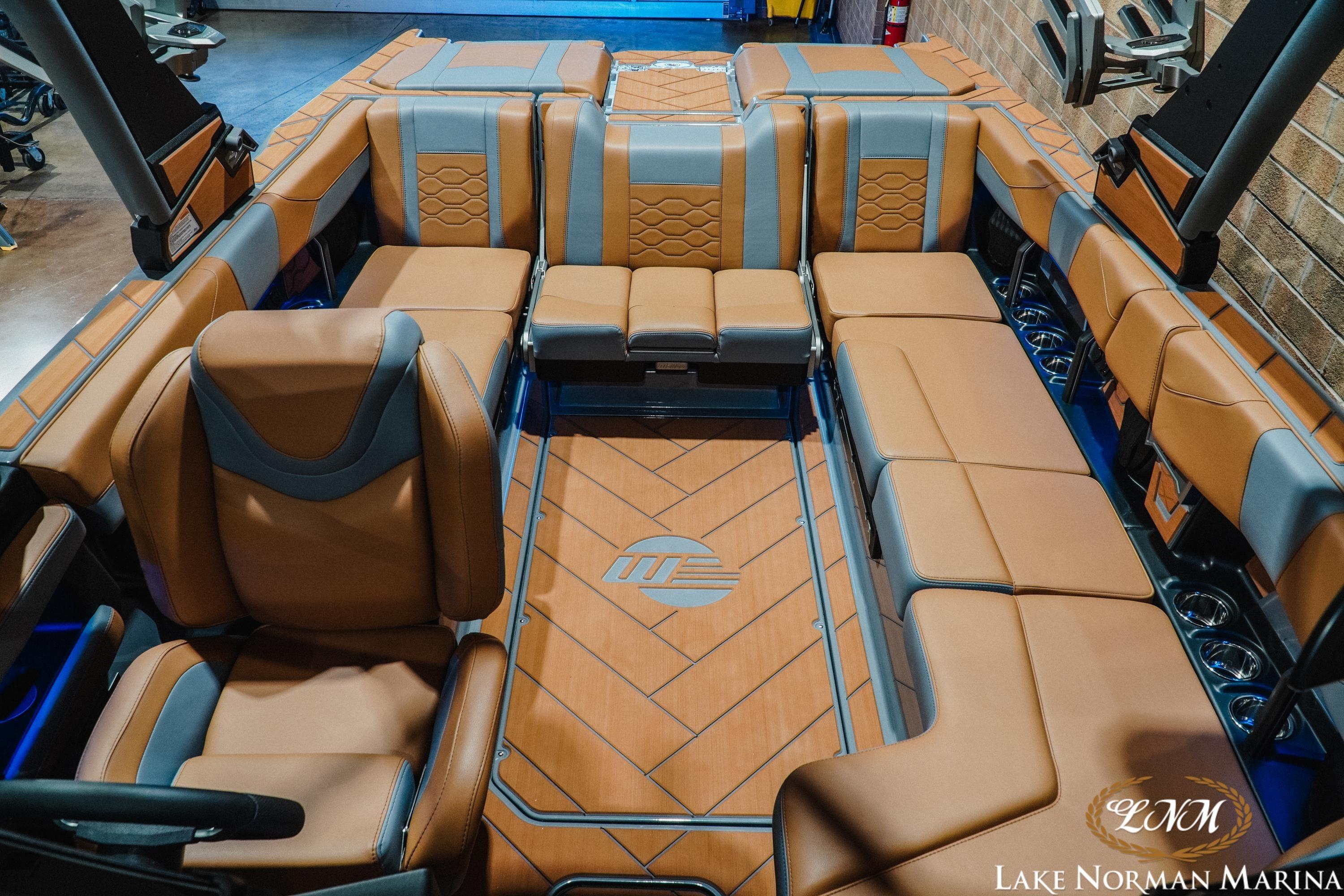 Luxurious interior of 2026 Malibu Wakesetter 23 LSV boat with brown leather seating.