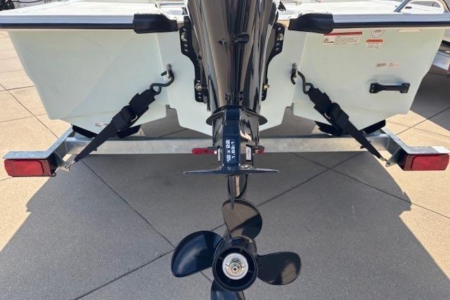 2026 Mako Pro Skiff 15 CC boat stern with motor and propeller detail.