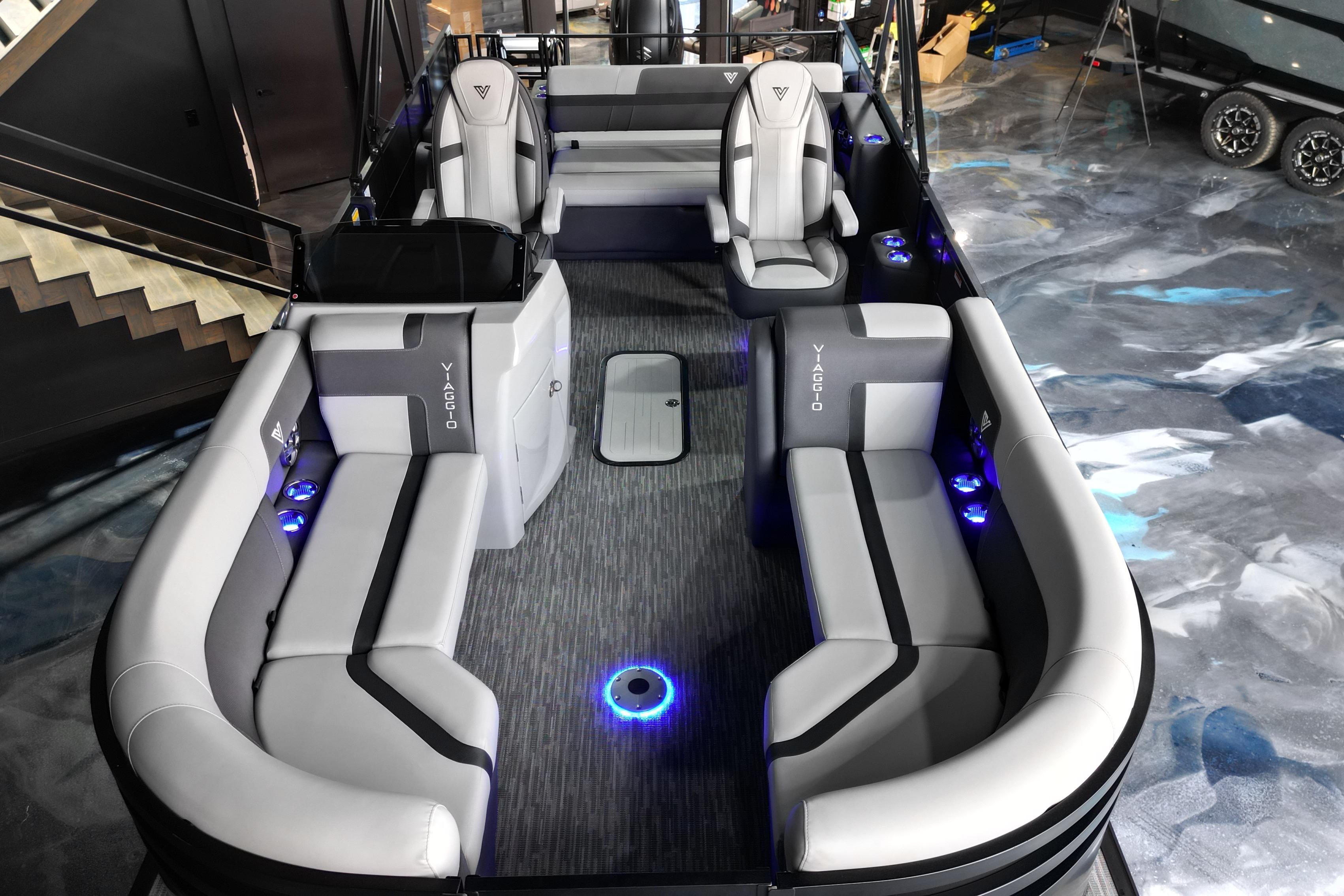 Luxurious 2026 Viaggio Lago X-S 22 pontoon boat interior with modern seating and ambient lighting.