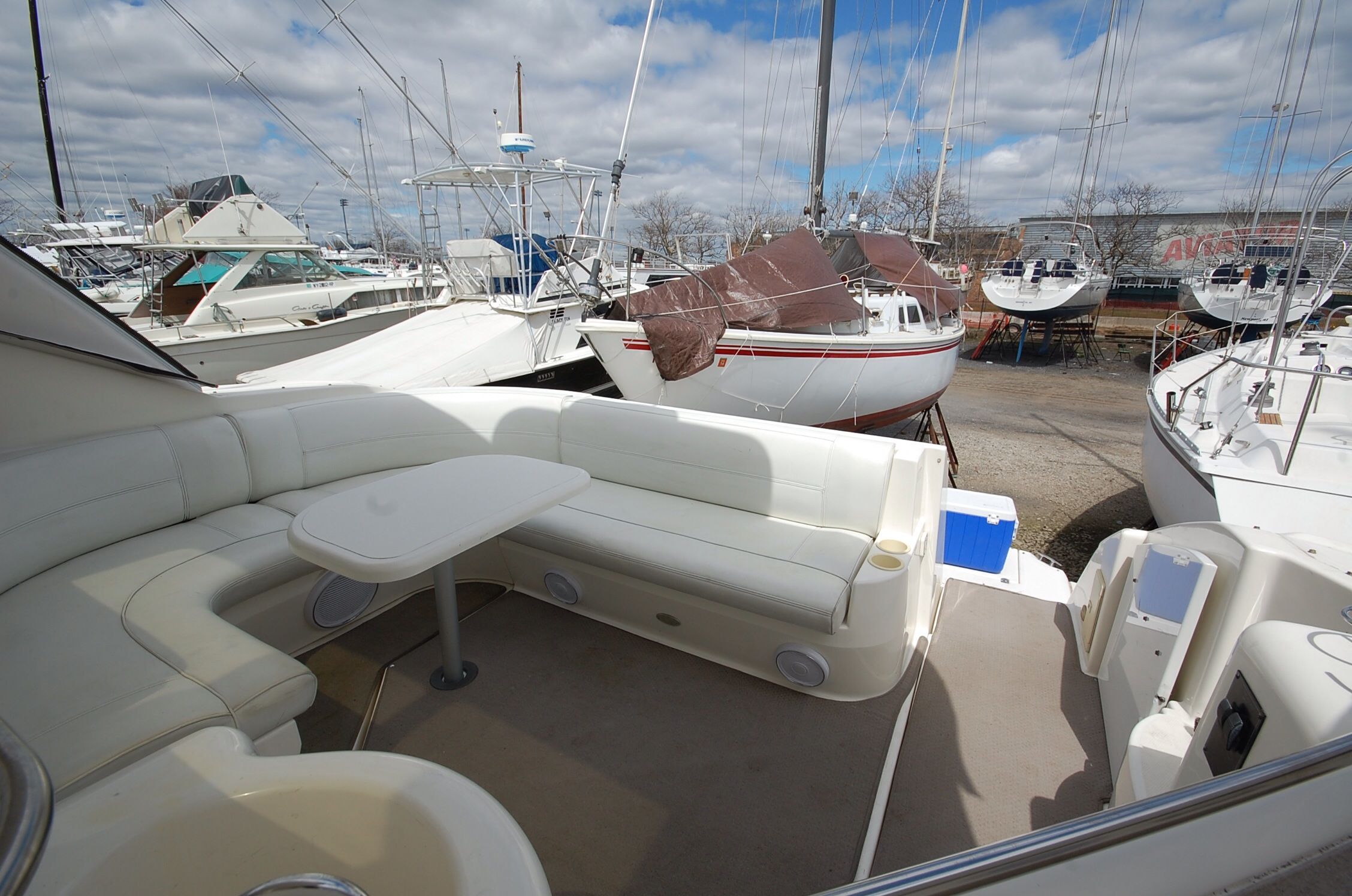 2004 Cruisers Yachts 3970 with spacious cockpit and outdoor seating area.