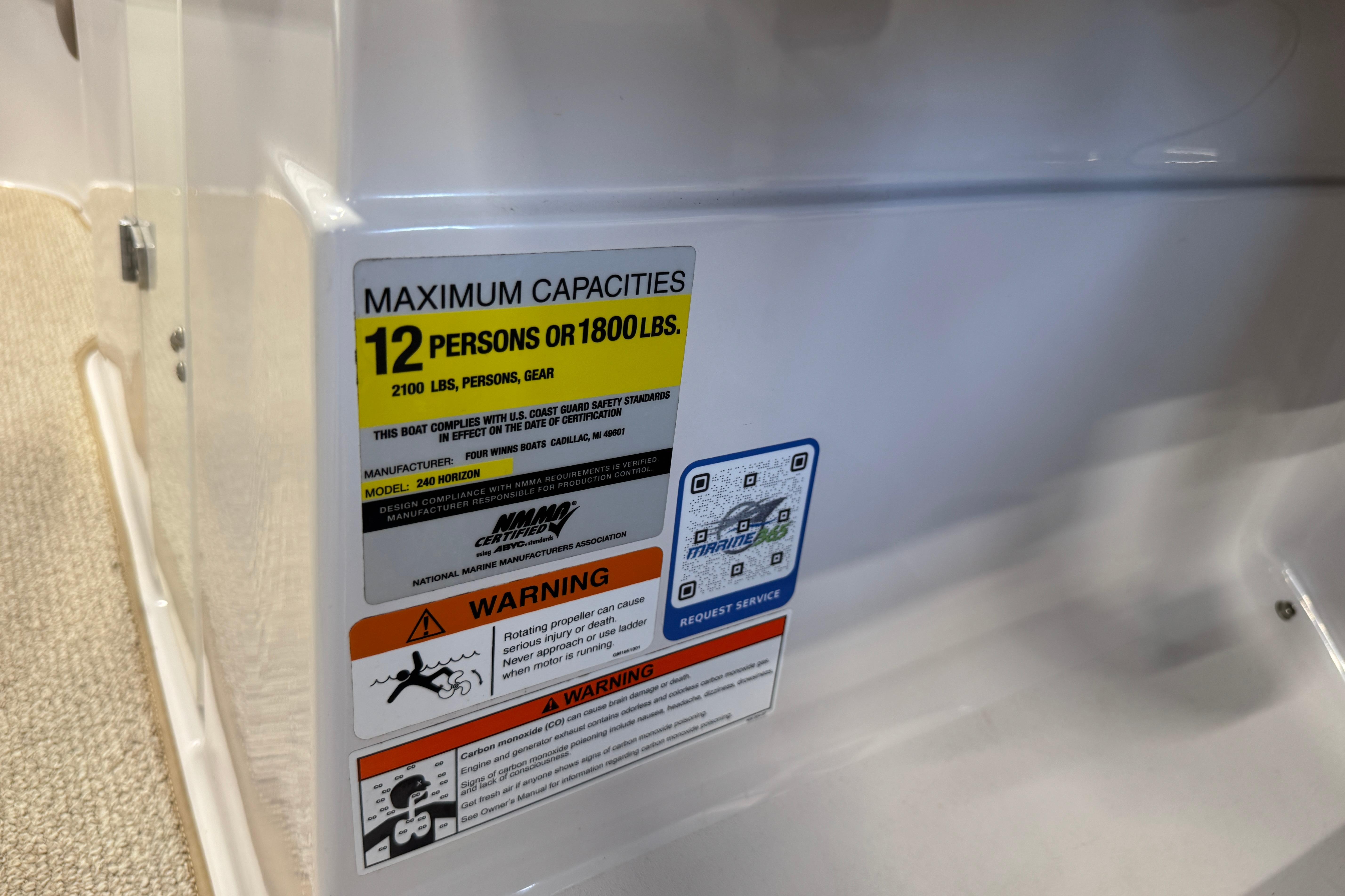 Capacity label on 2008 Four Winns H240 boat, max 12 persons or 1800 lbs.