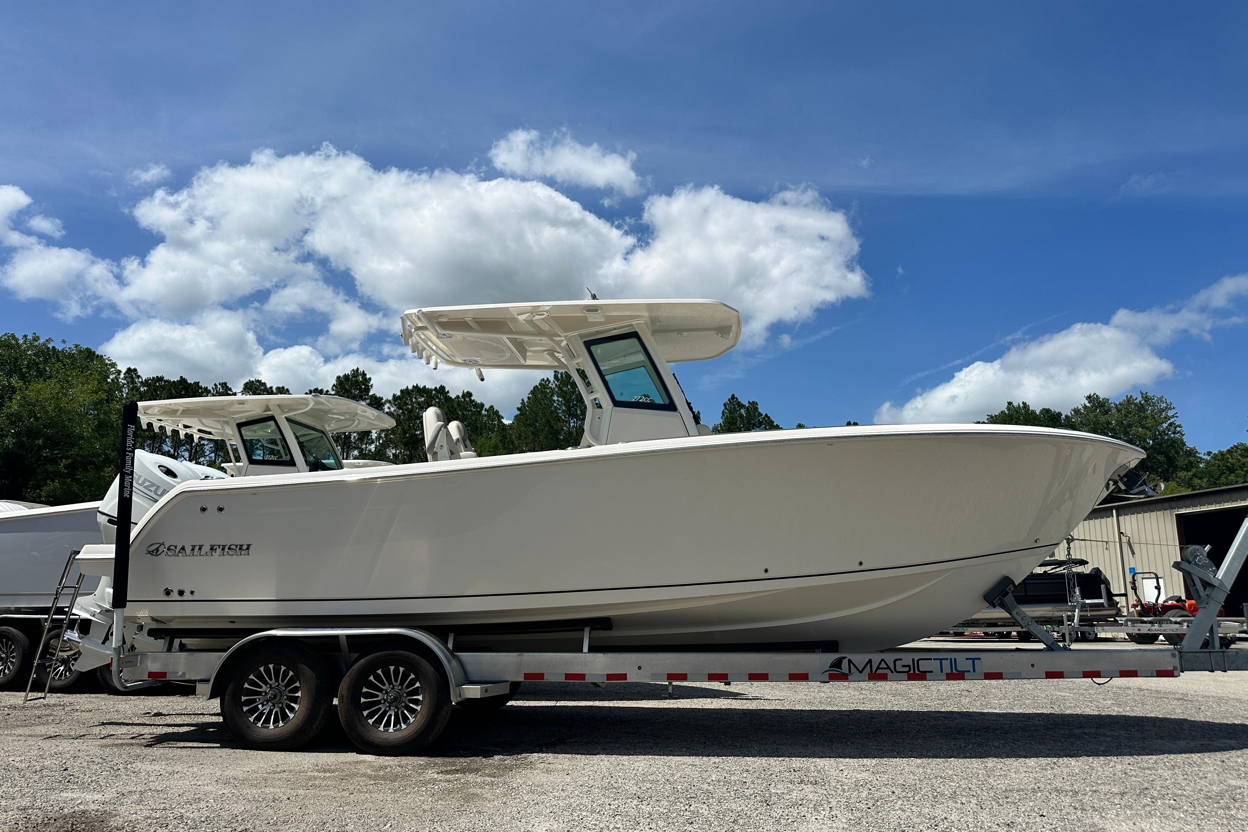 2026 Sailfish 272 CC boat on trailer under blue sky.