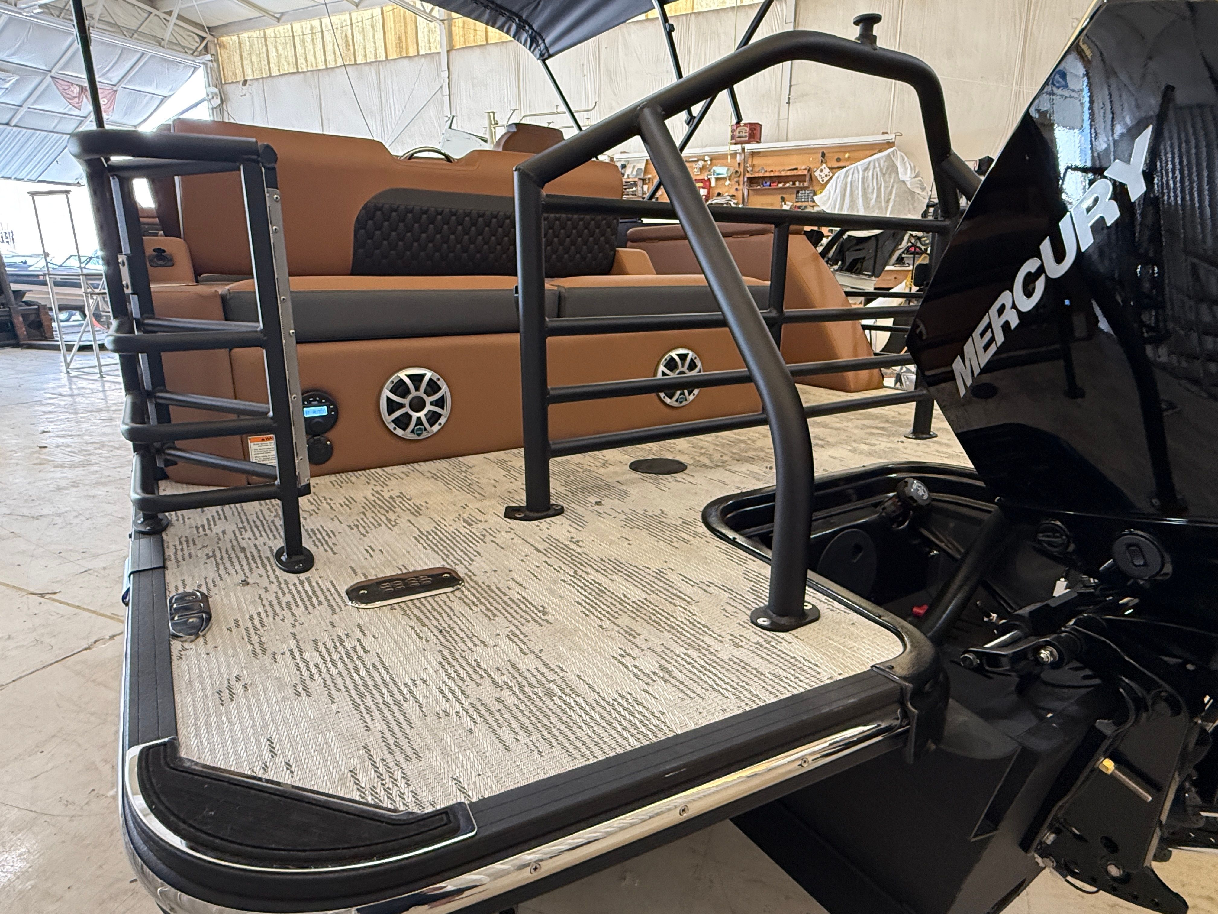 The image shows the rear of a 2026 Sylvan L3 ULZ DH boat with a Mercury engine.