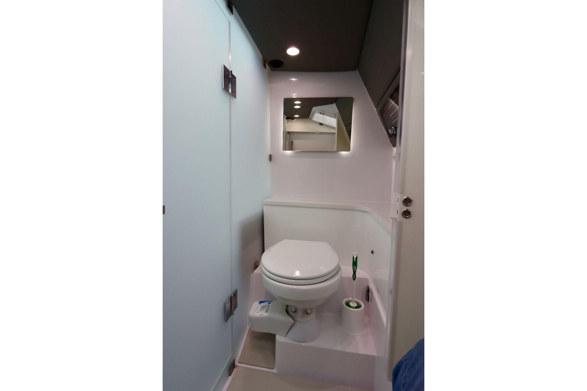 Modern bathroom interior in 2022 Axopar 37 XC Cross Cabin boat.
