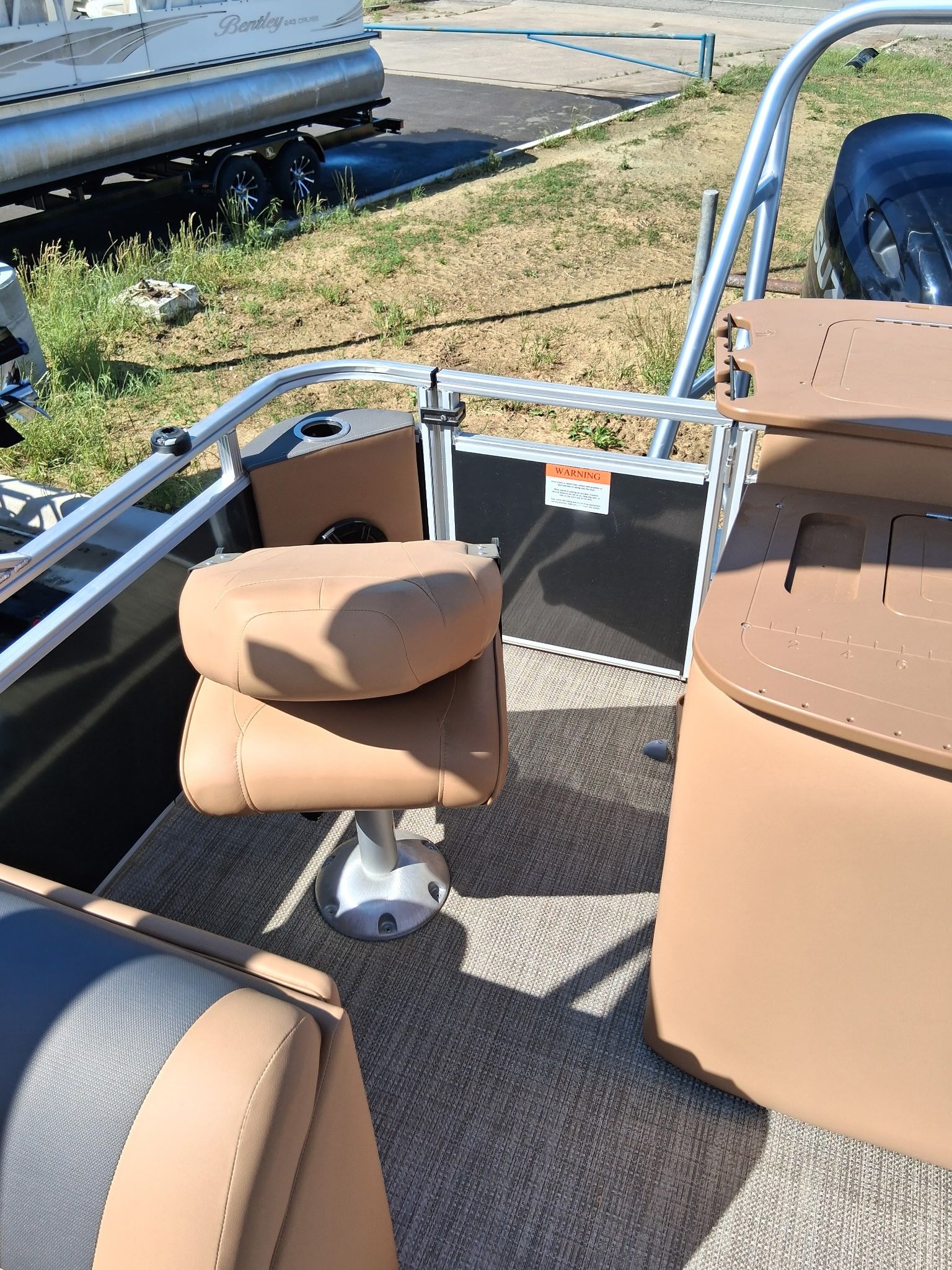 Interior of 2026 Landau Alure 23CC Fish-Charcoal with beige seating.