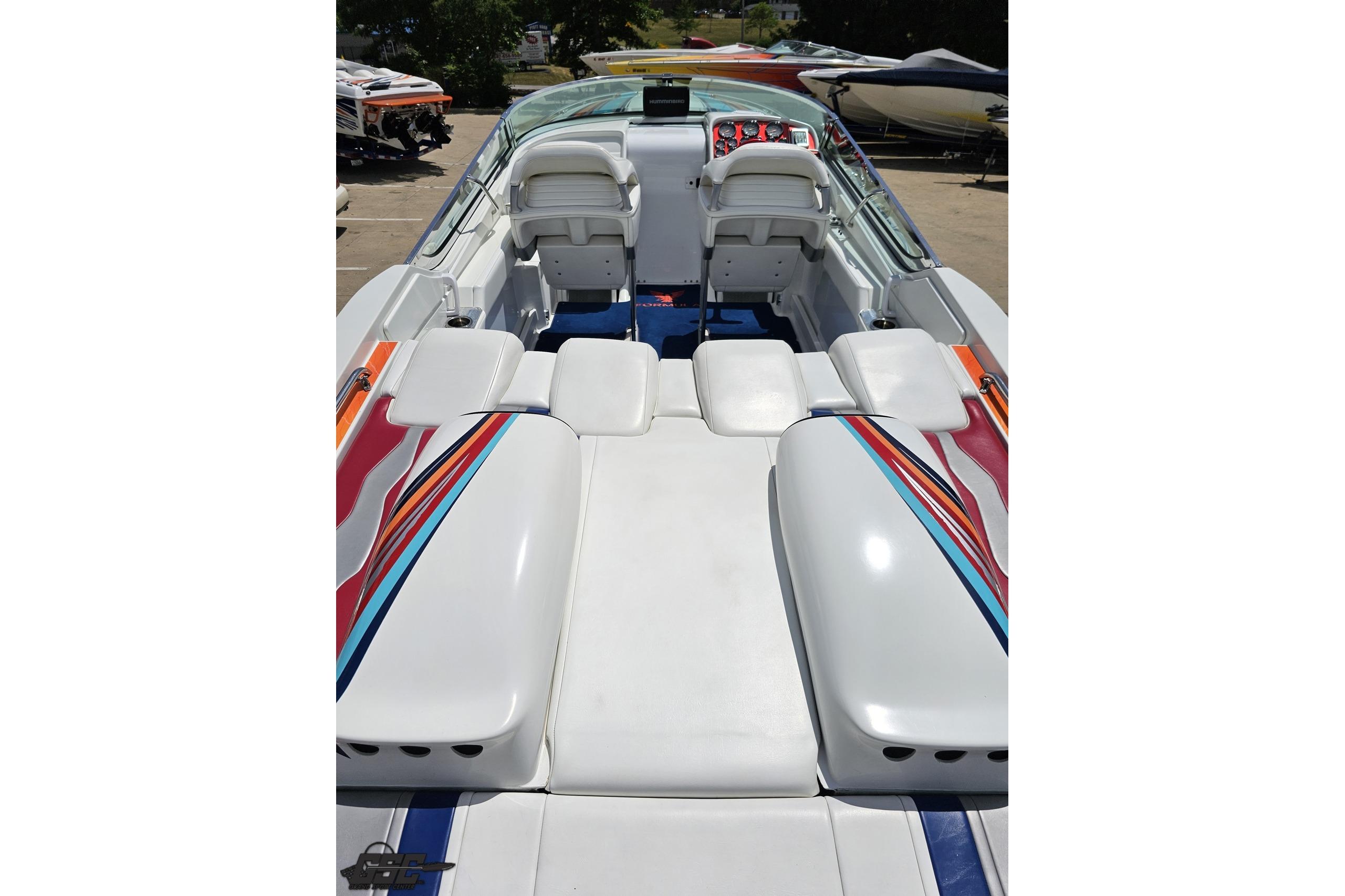 2002 Formula 382 FASTech boat interior with colorful upholstery and sleek design.