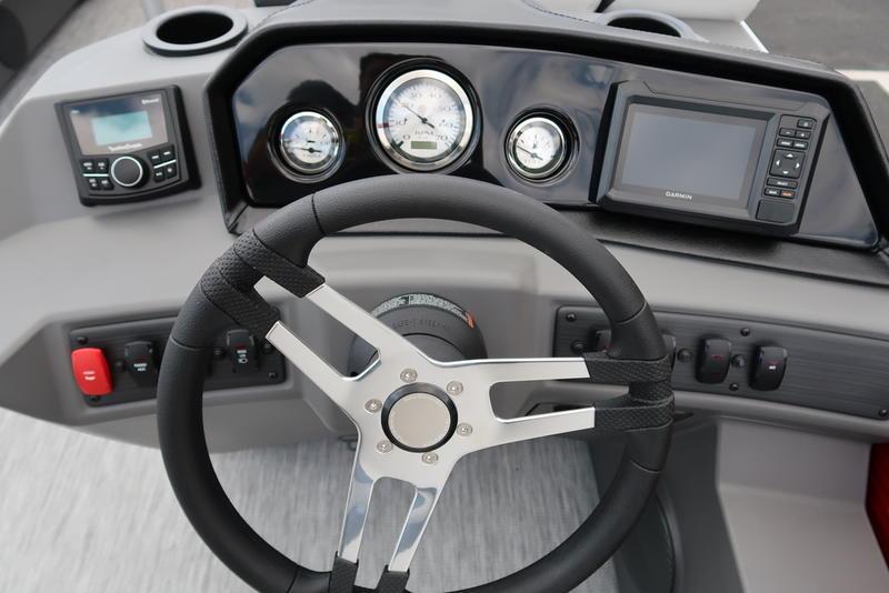 Steering console of 2026 Bennington S Quad Bench 20 SSR with gauges and controls.