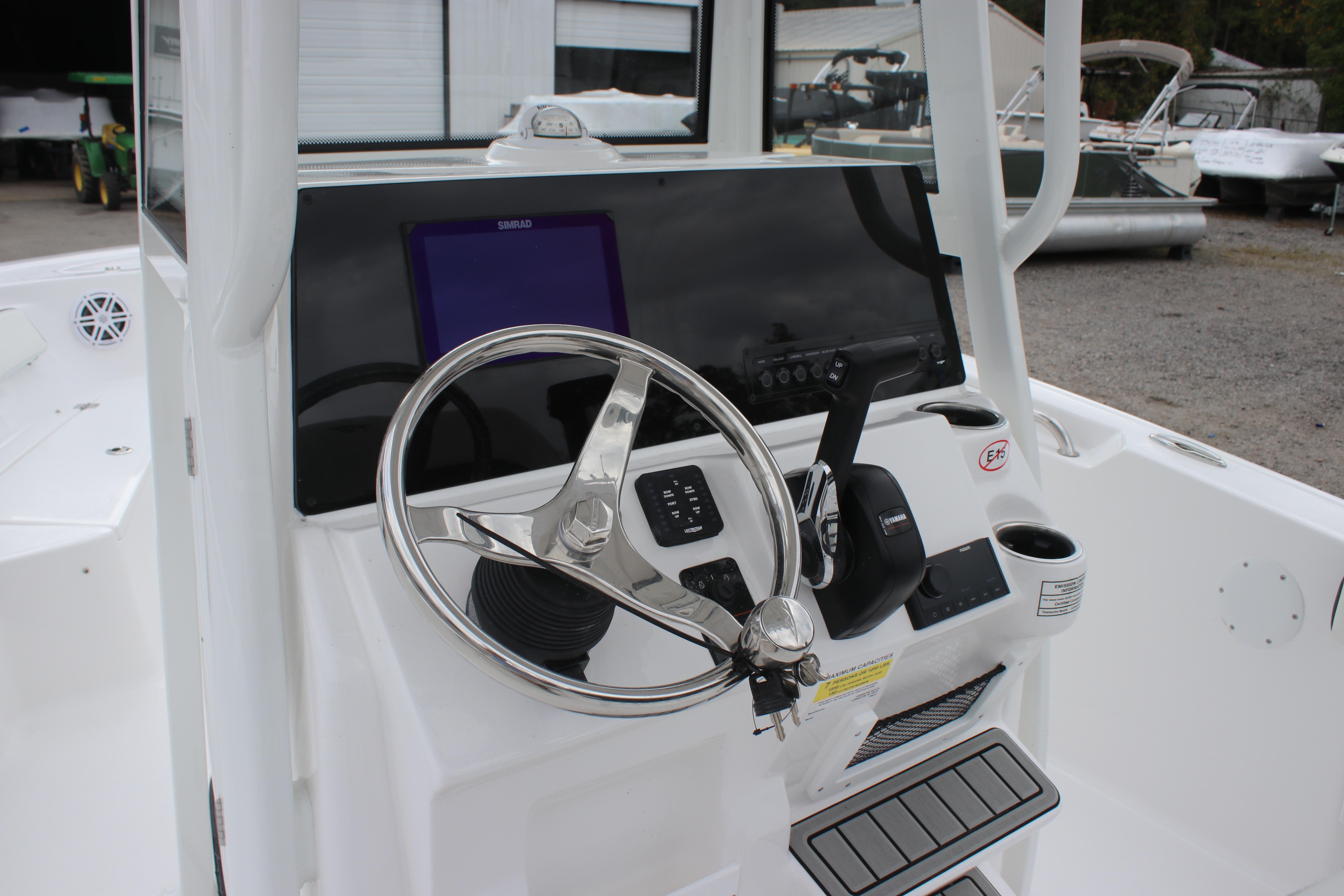 2026 Tidewater 198 CC Adventure boat console with steering wheel and controls.