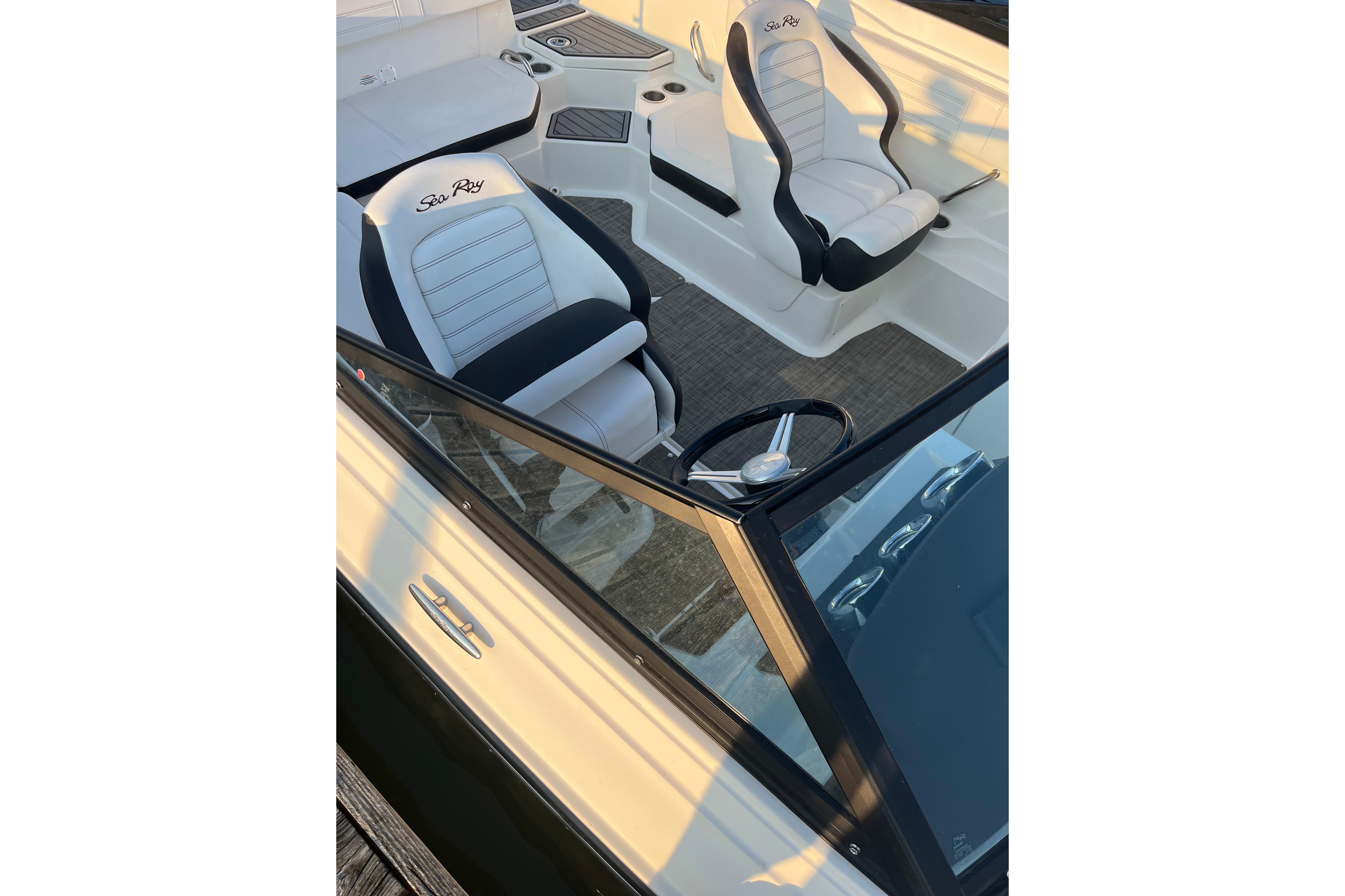 2020 Sea Ray SPX 210 boat interior with steering wheel and seating.