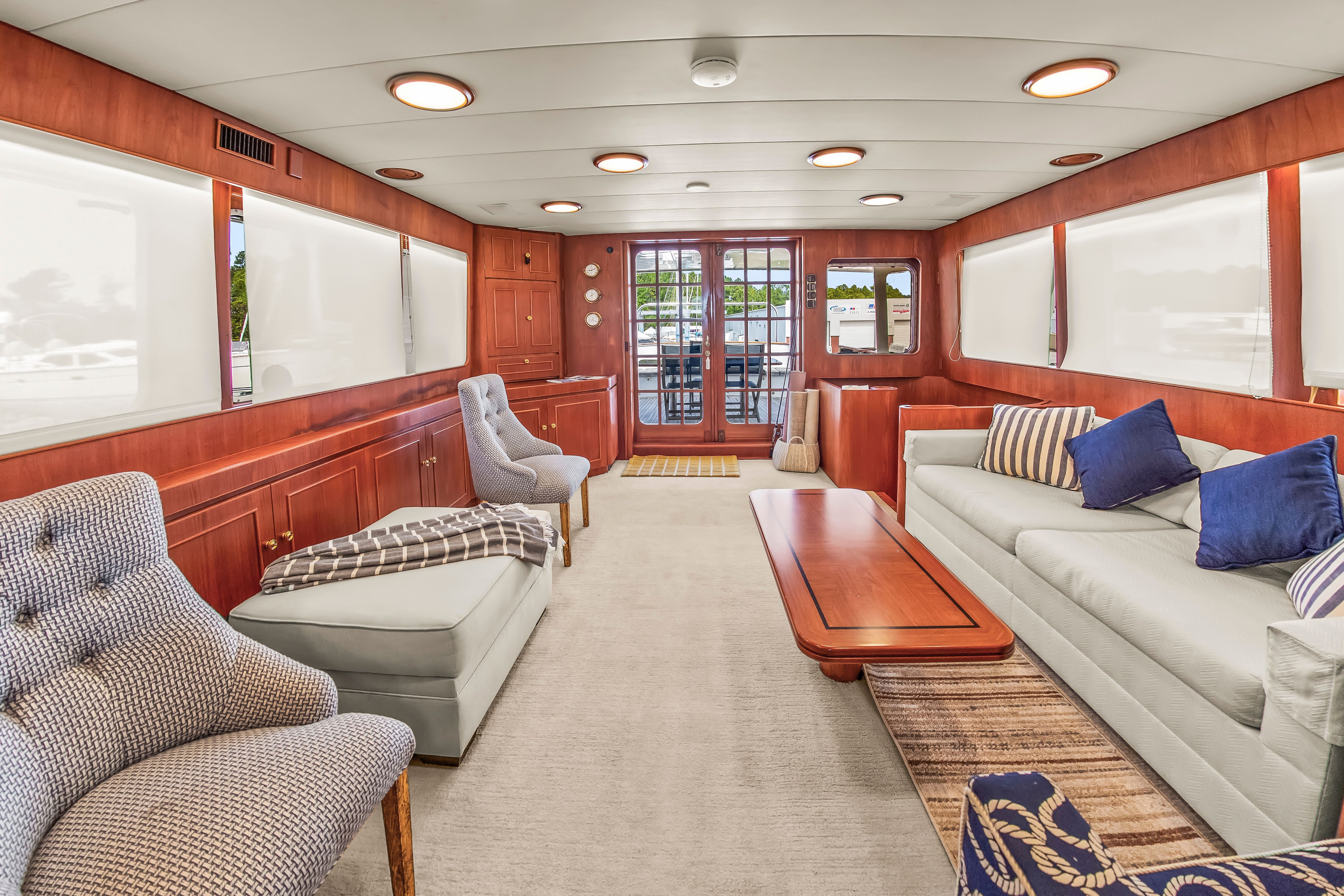 Interior of a 1987 Jongert 78 Motor Yacht with elegant furnishings and wood paneling.