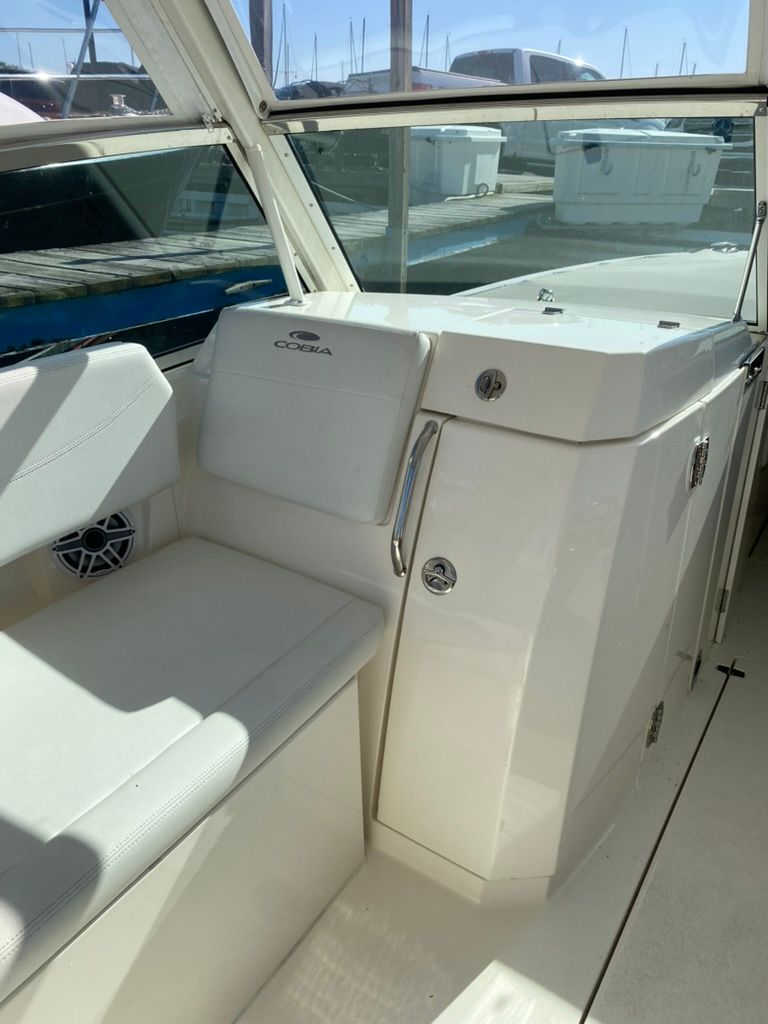 Interior of 2023 Cobia 330 boat with seating area.