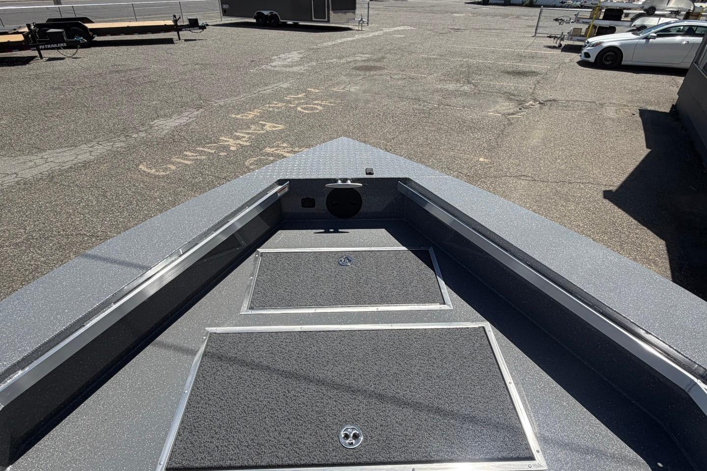 2026 Thunder Jet 209 Rush OT boat deck, featuring storage compartments and sleek design.