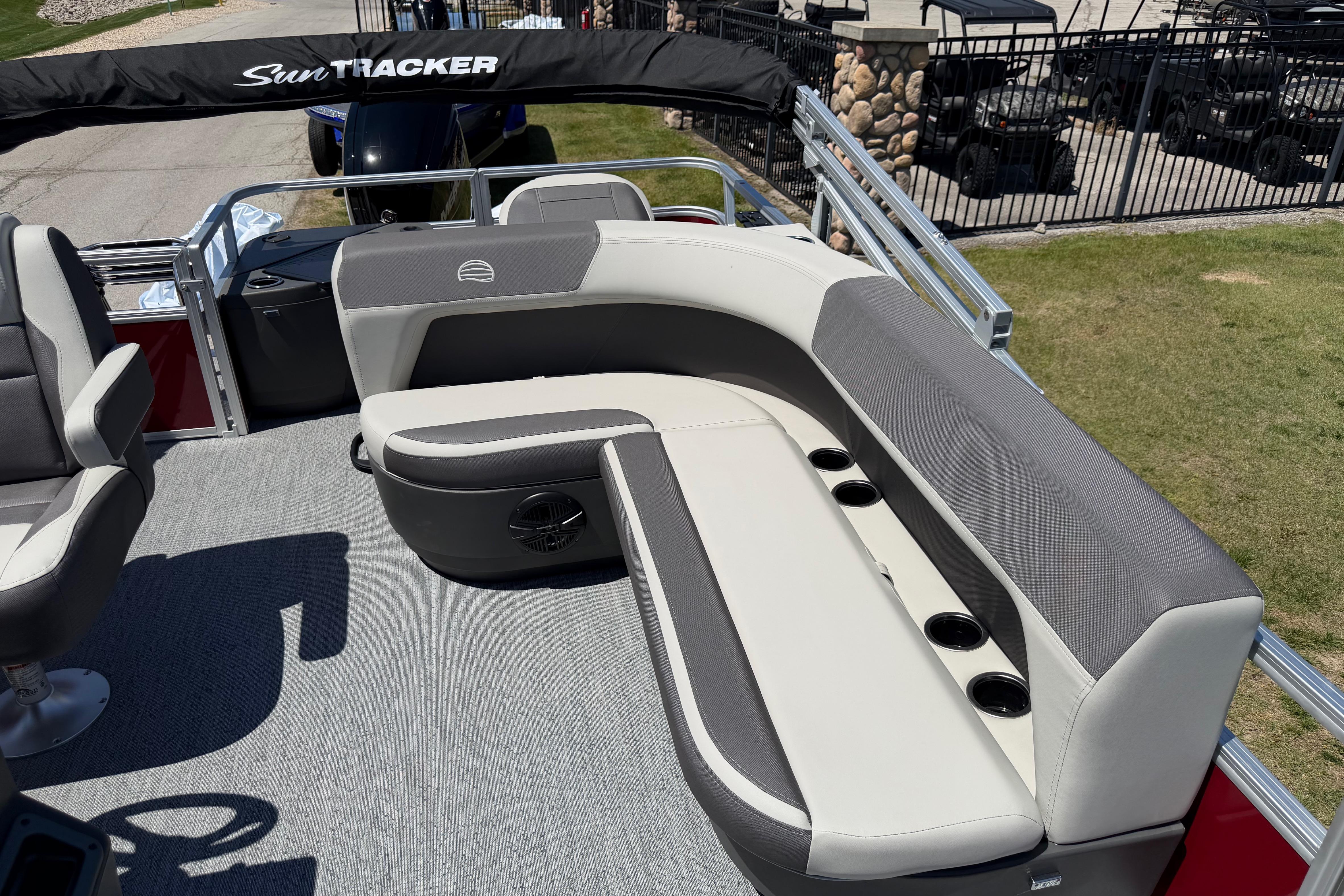 2026 Sun Tracker Bass Buggy 18 DLX pontoon boat with comfortable seating and cup holders.
