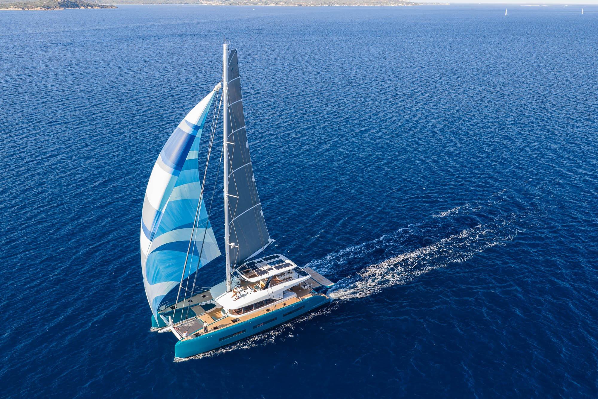 Sailing yacht Lagoon Eighty 2, 2026 model, cruising on open blue sea.
