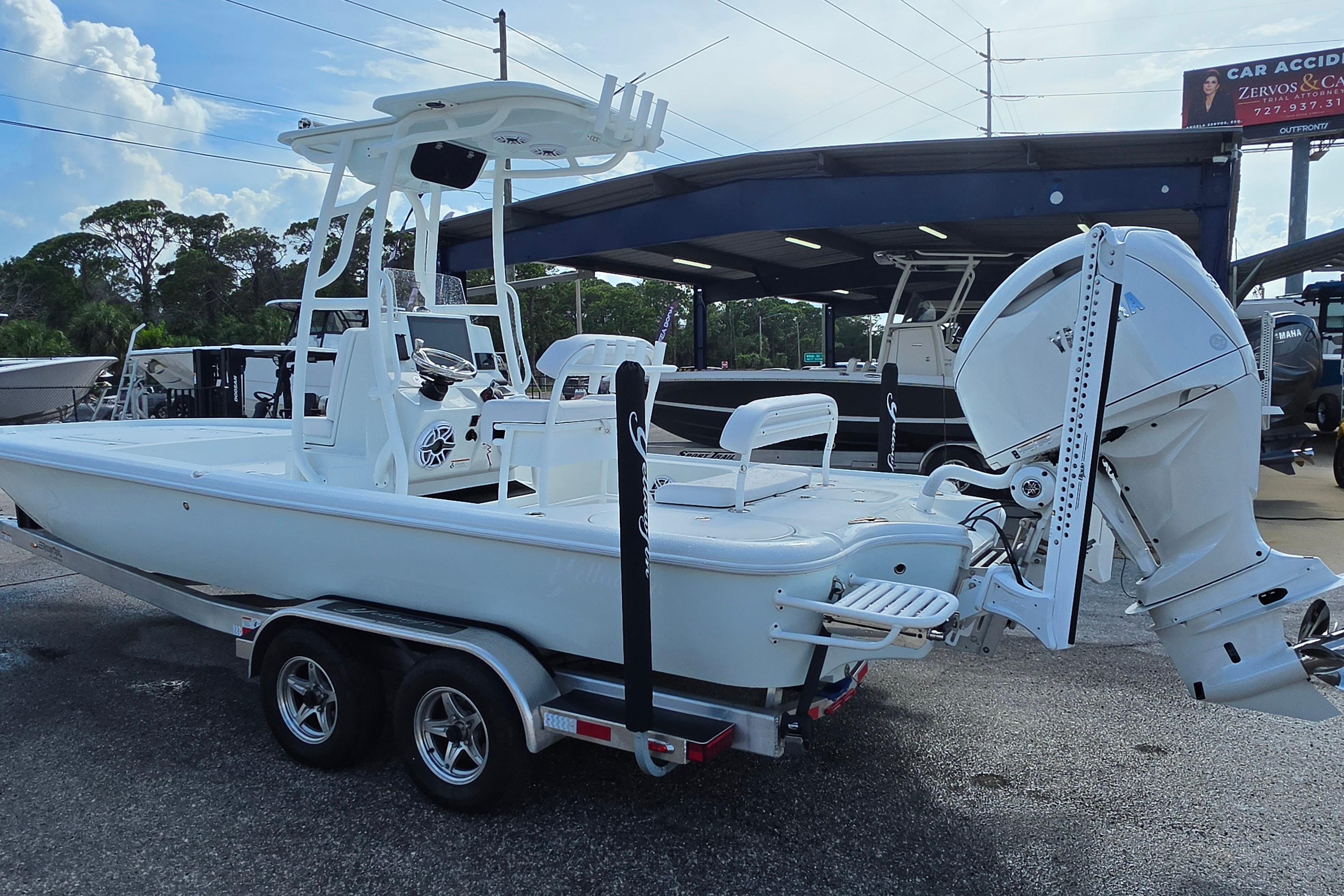2026 Yellowfin 24 Bay CE boat on trailer, featuring sleek design and powerful outboard motor.