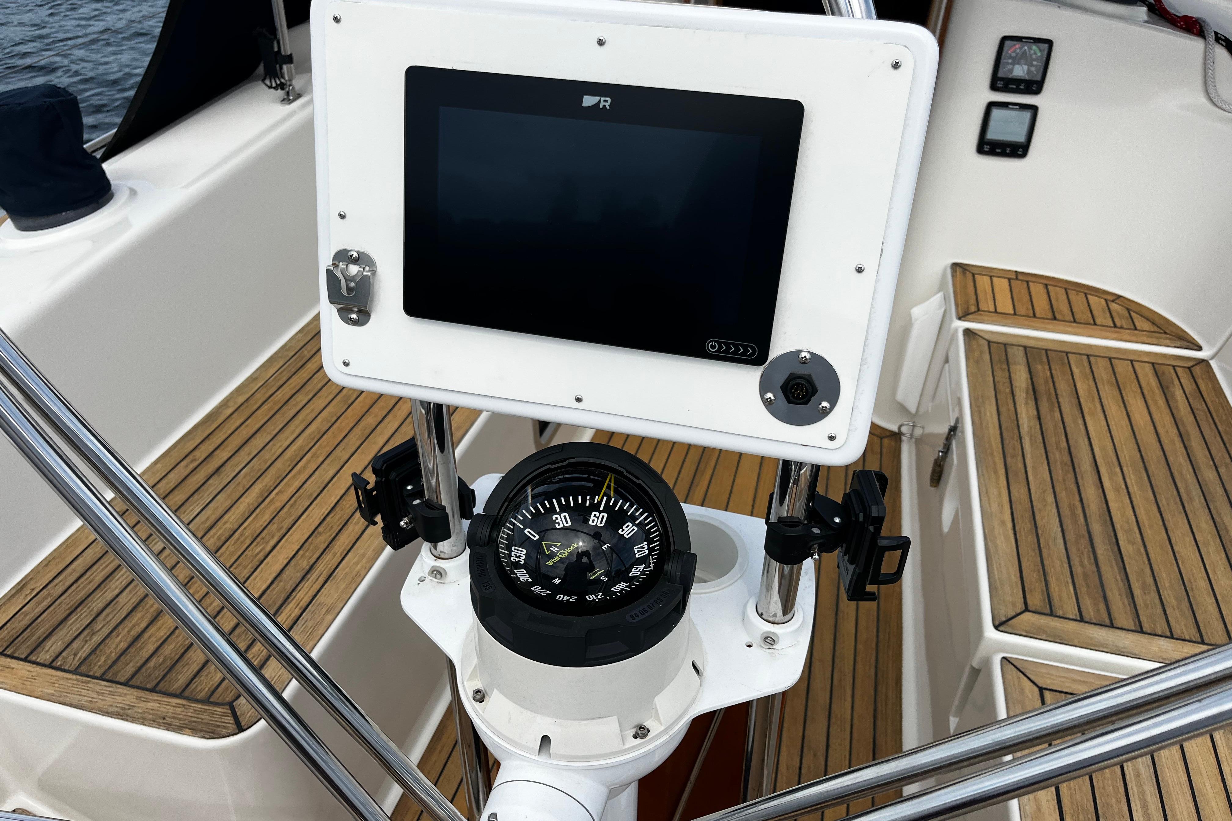 Cockpit of 2004 Hanse 411 sailboat with compass and navigation display.