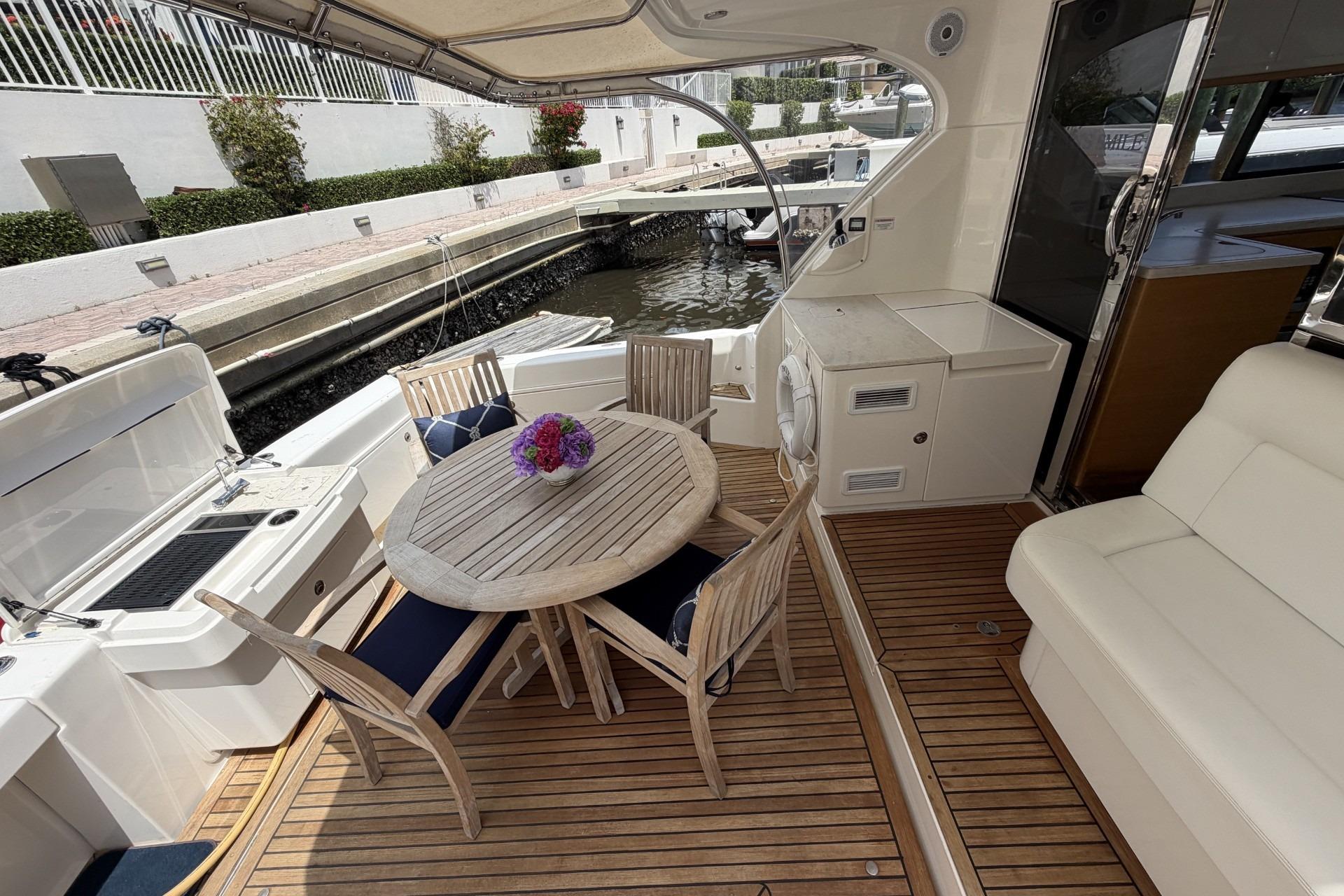 Luxurious 2015 Riviera 445 SUV with dining area and cockpit grill