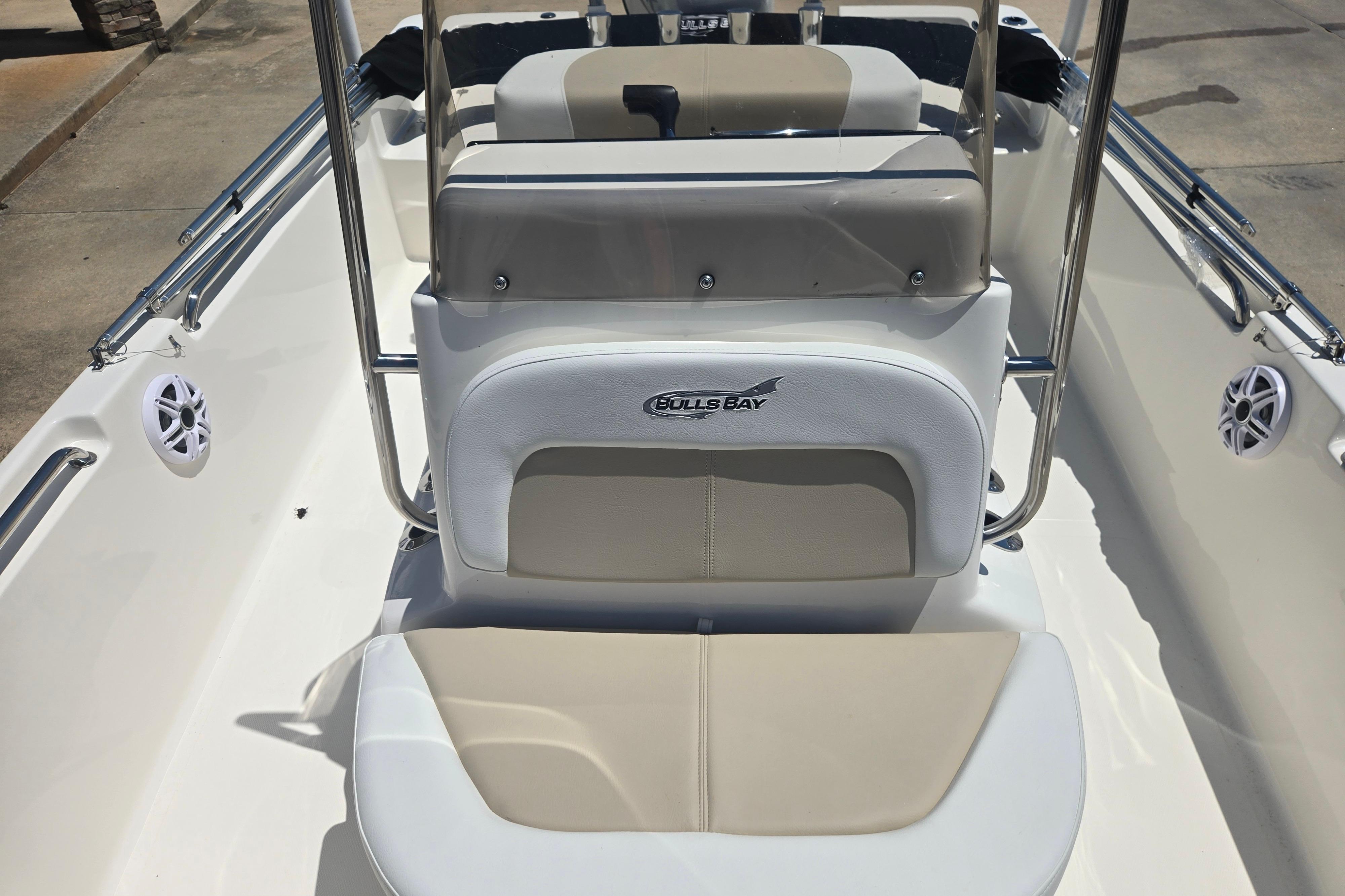 2026 Bulls Bay 2000 boat interior with beige seating and branded logo.