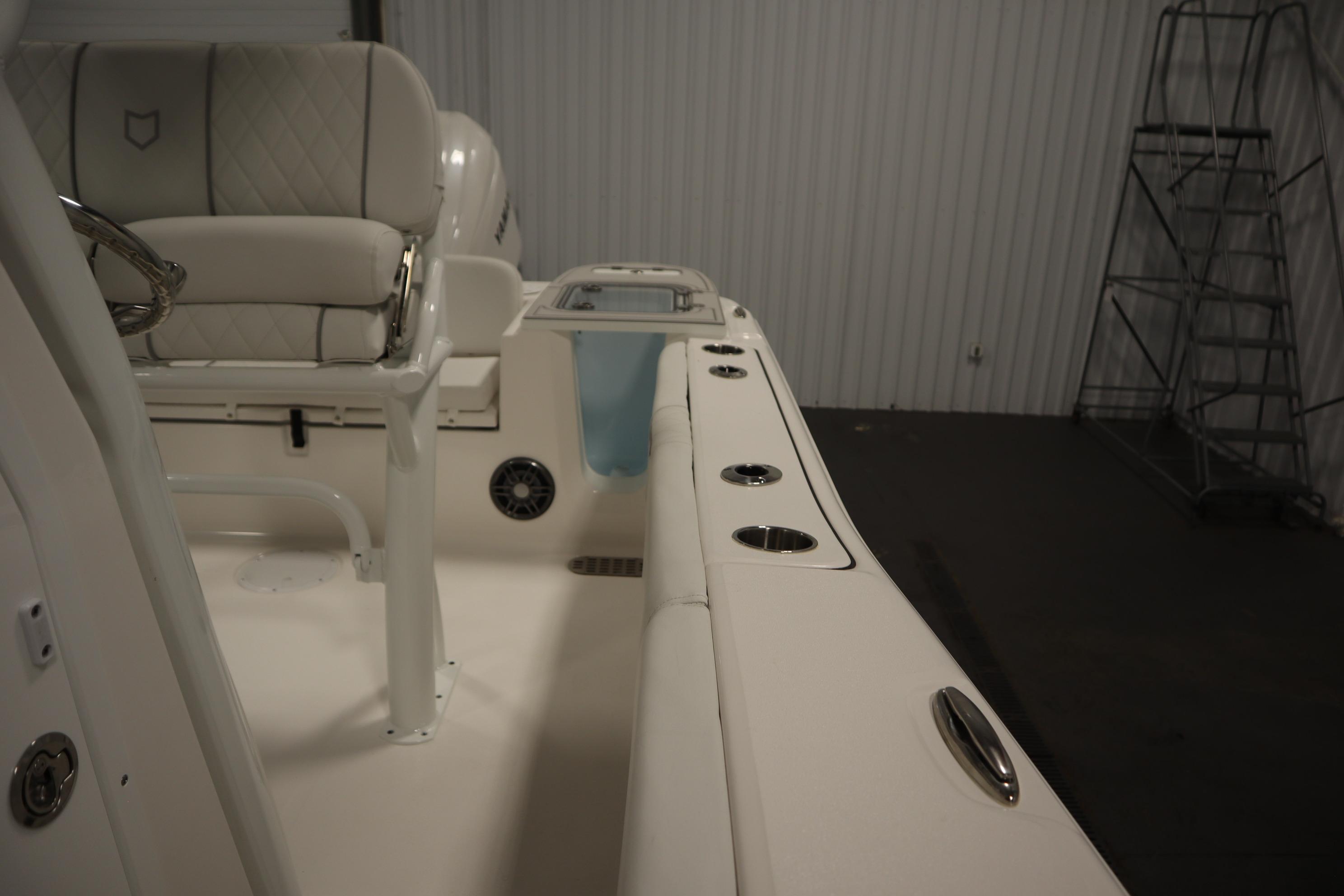 2026 Sea Fox 228 Commander boat interior with seating and cup holders.
