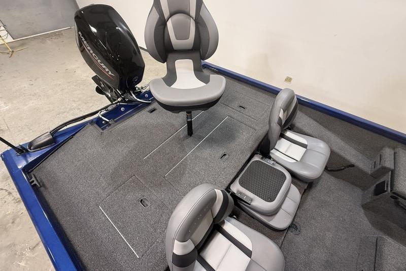 2026 Lowe Stinger 175C boat interior with gray seating and carpeted deck.
