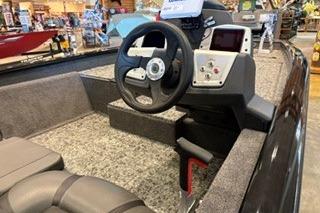 2026 Tracker Pro Team 175 boat interior with steering wheel and dashboard controls.