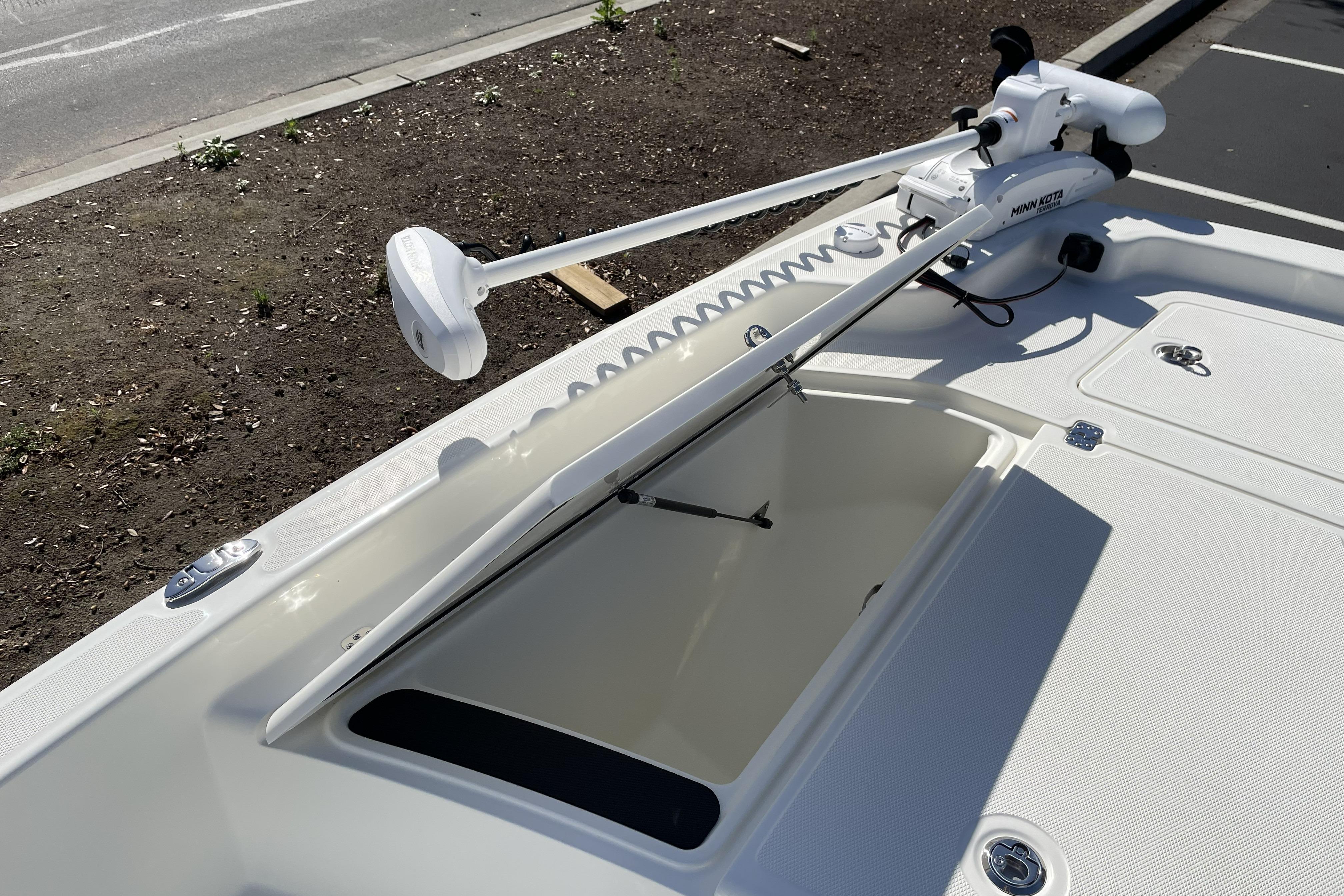 2026 Mako Pro Skiff 19 CC boat with Minn Kota trolling motor on deck.