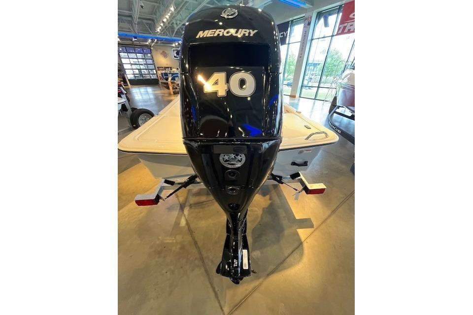 2026 Mako Pro Skiff 15 CC with Mercury 40 outboard motor in showroom.