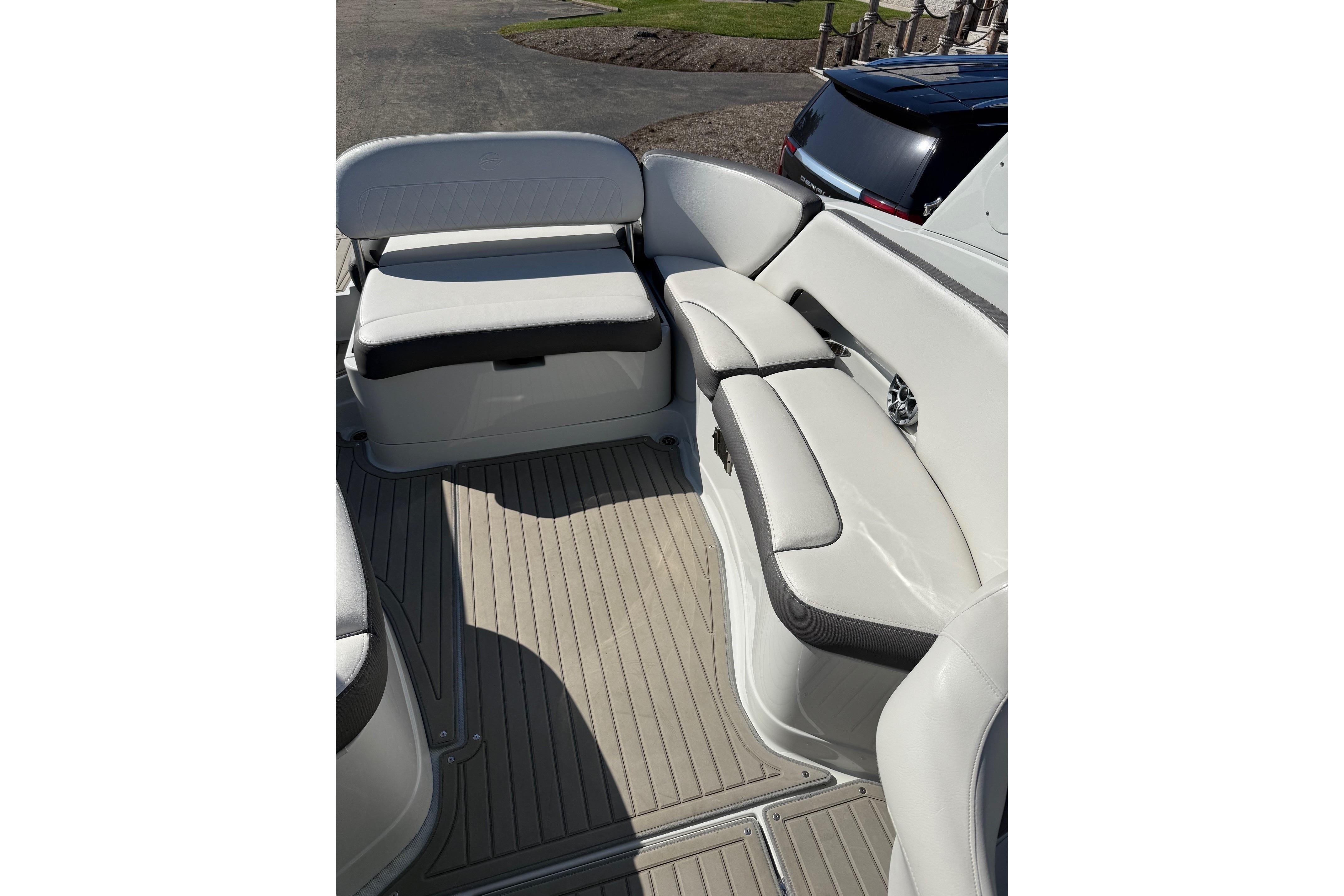 2023 Crownline 290 SS boat interior with white seating and gray flooring.
