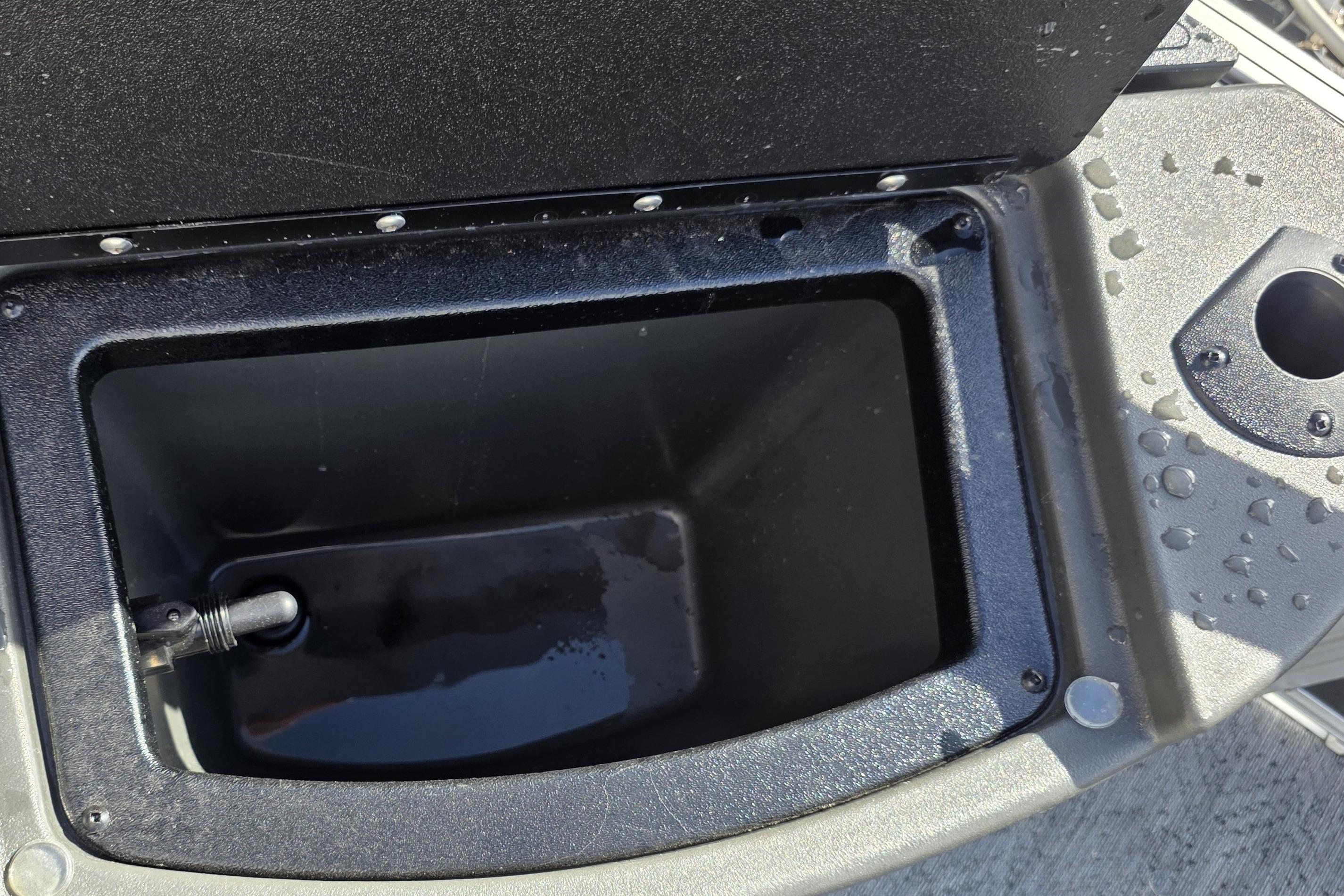 Livewell compartment on 2026 Sun Tracker Bass Buggy 16 XL Select boat, partially filled with water.