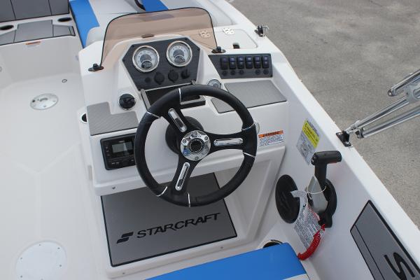 2025 Starcraft SV 16 OB boat dashboard with steering wheel and control panel.