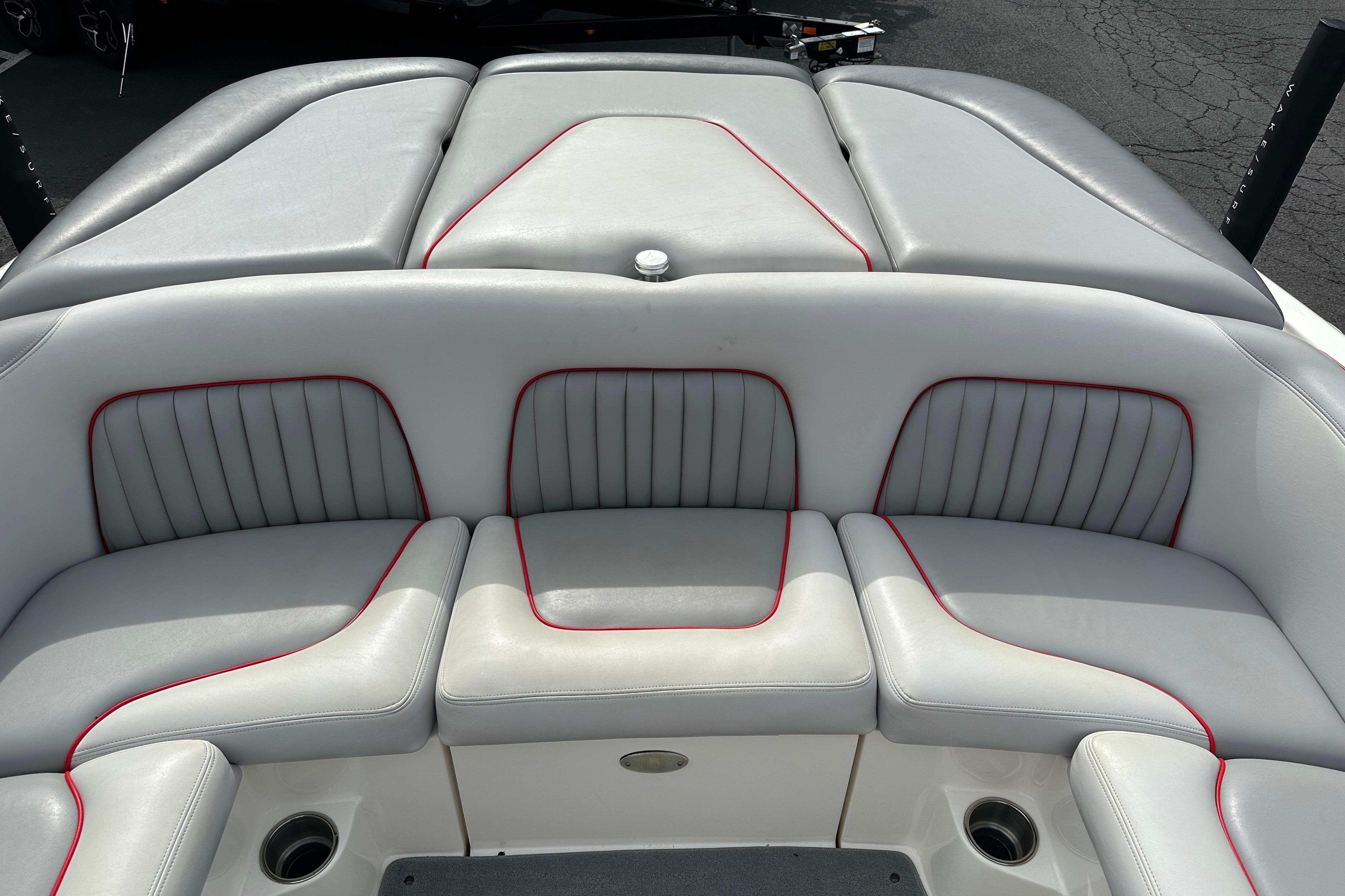 2008 Centurion Enzo SV240 boat interior with gray and red-trimmed seating.