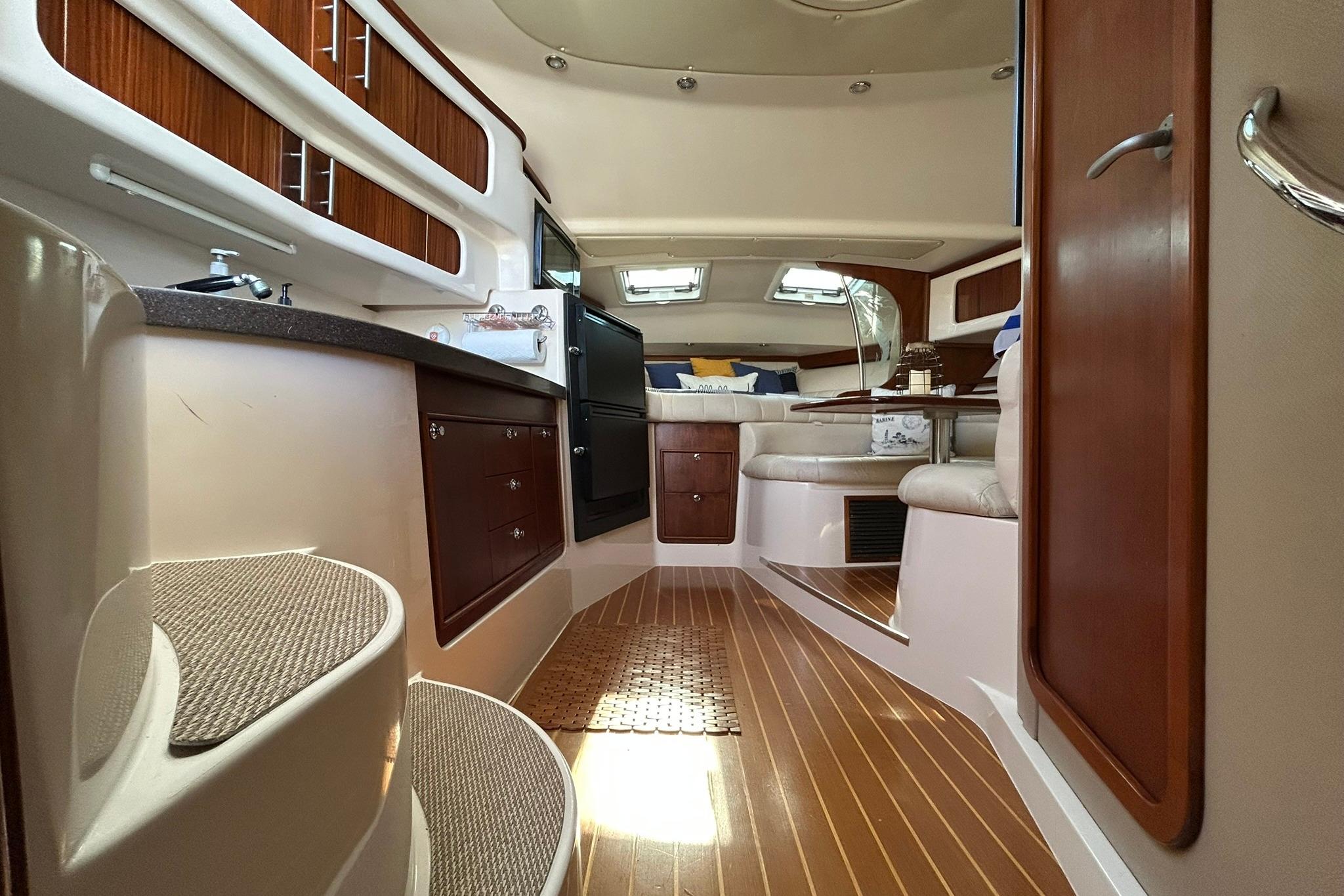 Luxurious interior of 2007 Grady-White Express 360 boat with wood accents and seating area.