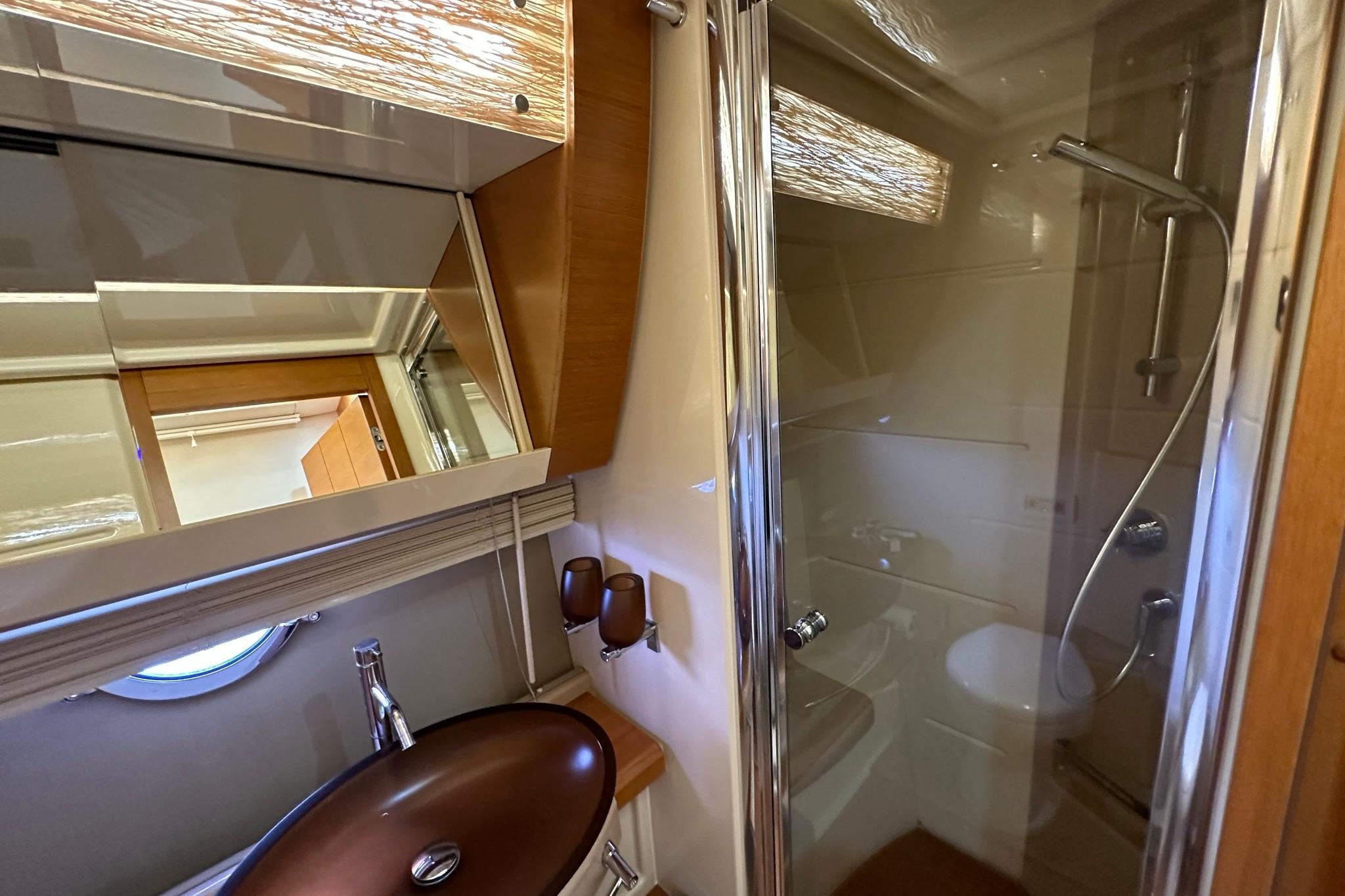 Luxurious bathroom in 2013 Azimut Fly 53 yacht with modern fixtures and shower.