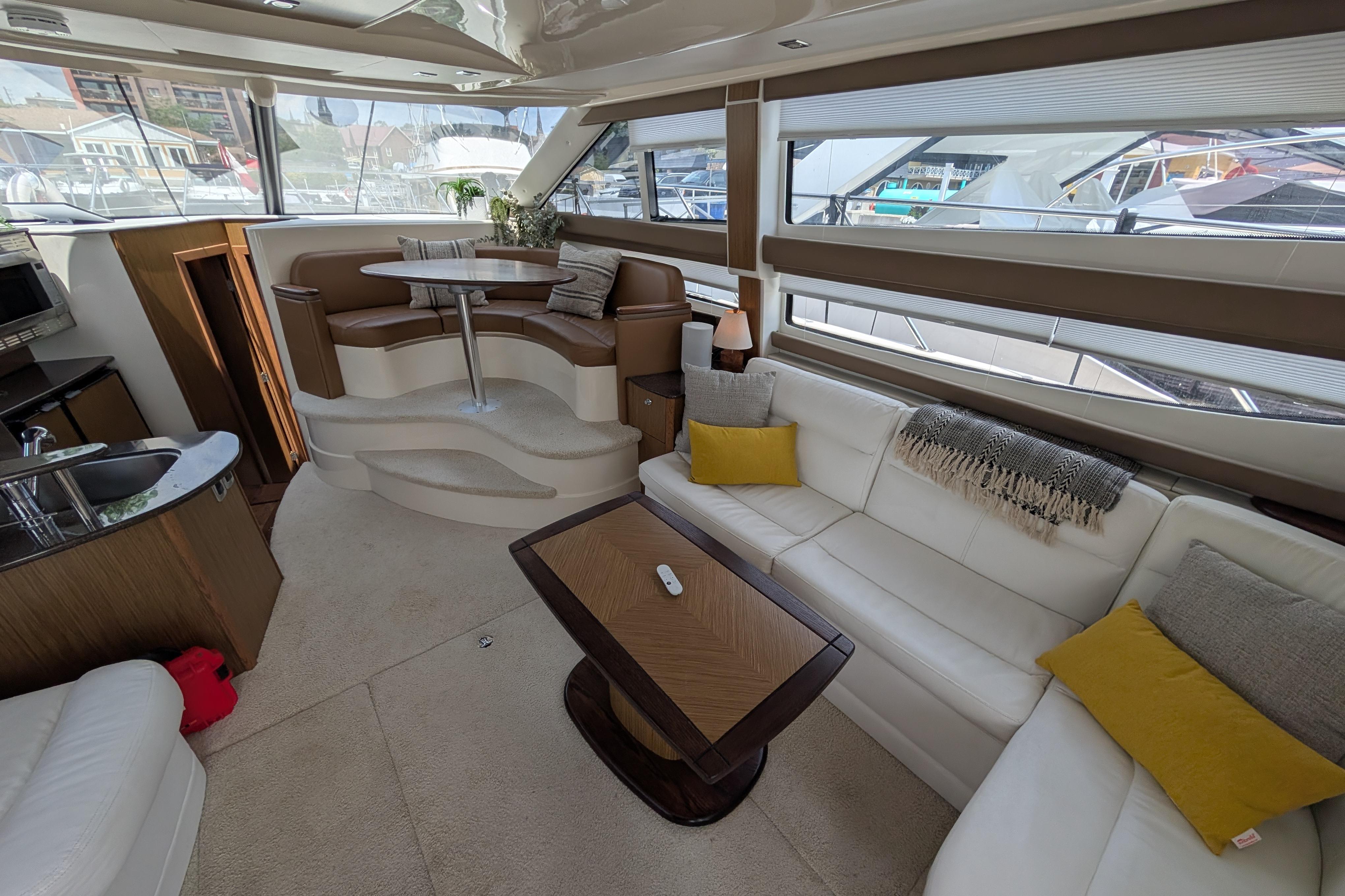Luxurious interior of a 2016 Meridian 391 Sedan yacht with plush seating and modern amenities.