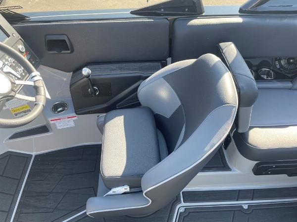 2025 Moomba Mondo boat interior with gray seating and steering wheel.