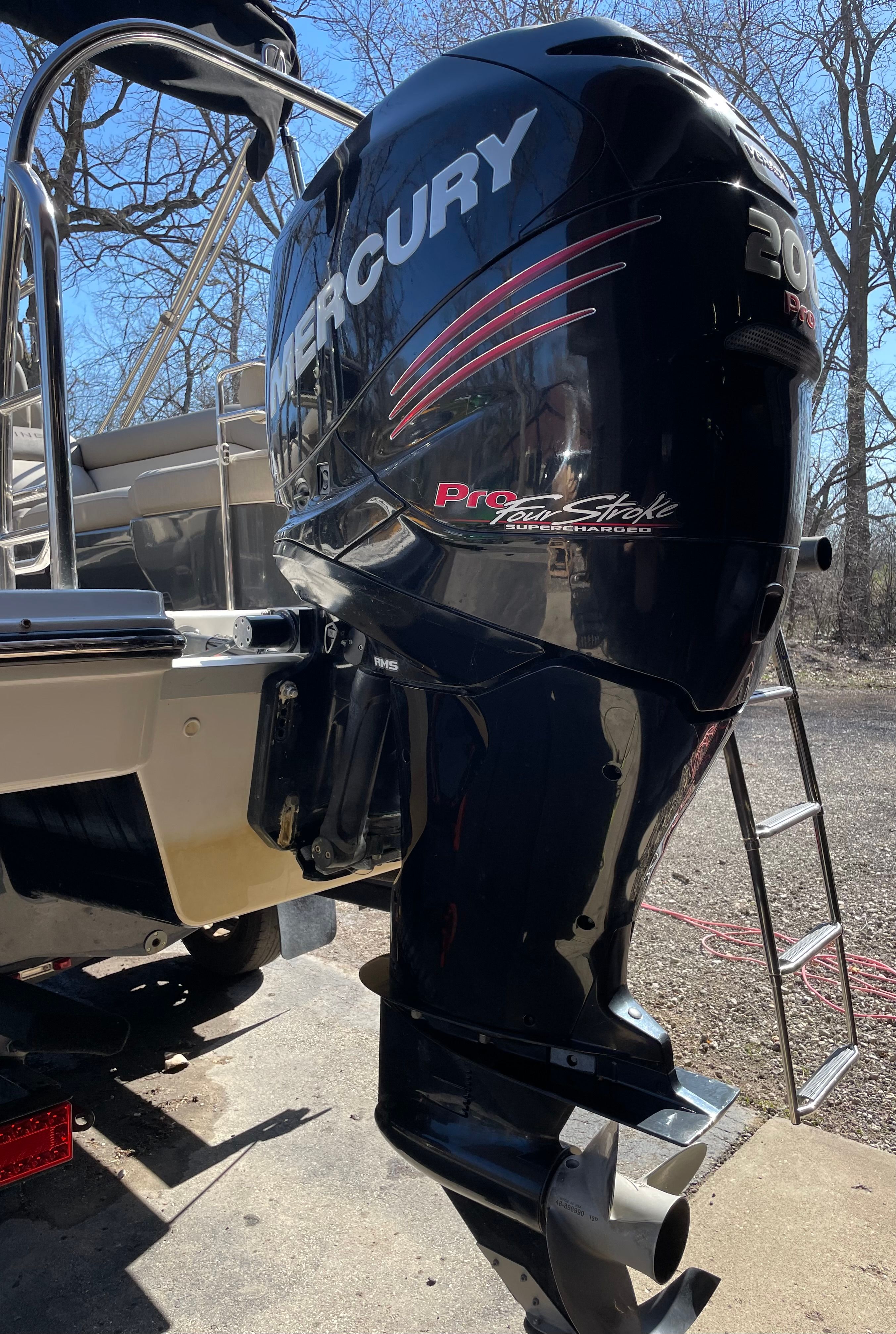 A Mercury outboard motor is mounted on a 2016 Bayliner Element XR7.