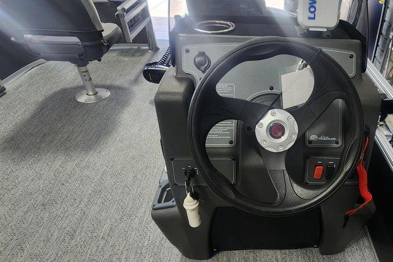2026 Sun Tracker Bass Buggy 16 DLX steering console with modern controls and seating.