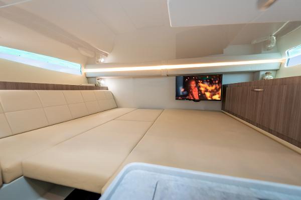 Manufacturer Provided Image: Luxurious interior of 2026 Regal 38 SAV yacht with spacious seating and TV.