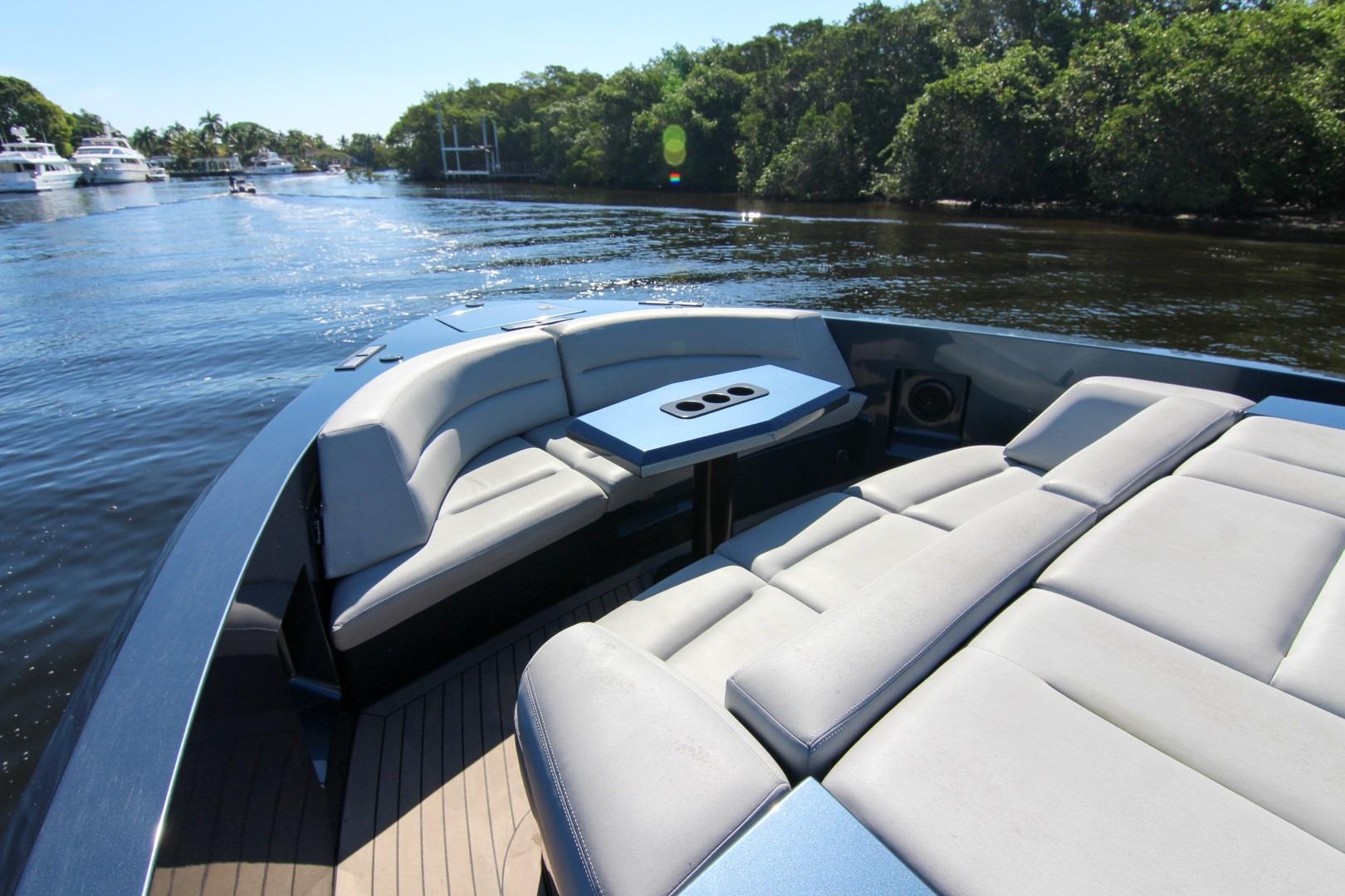 Luxurious 2022 Vanquish Yachts VQ45 with spacious seating on a serene waterway.